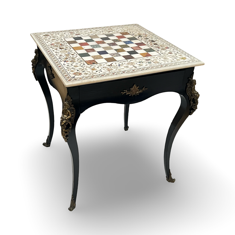 Lot 275: An Indian Pietra Dura Inlaid Marble Chess Board on a European Ebonized Game Table, 18TH Century