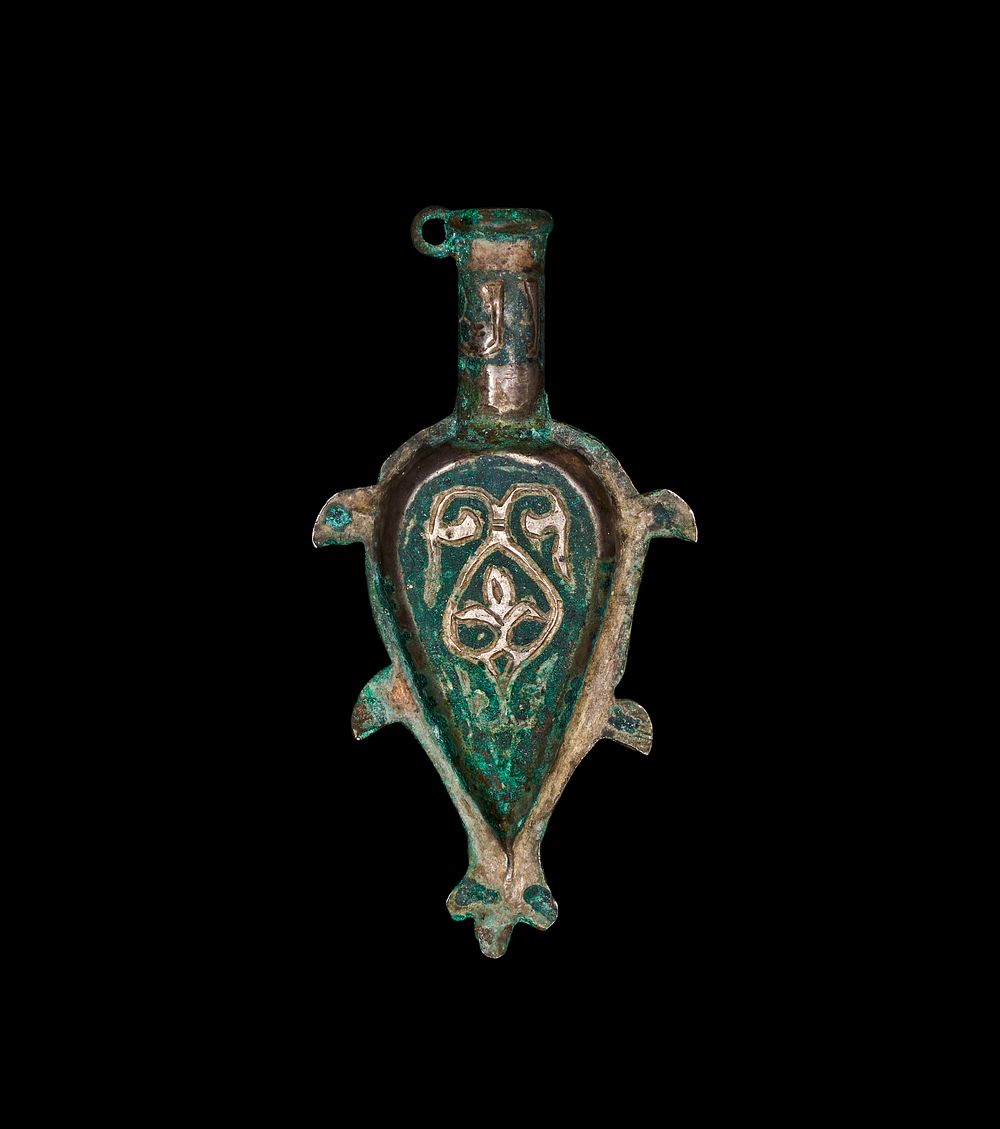 Lot 254: A MEDIEVAL ISLAMIC SILVER-INLAID COPPER ALLOY PILGRIM FLASK, PERSIA, 11TH CENTURY