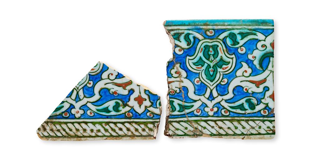 Lot 88: TWO IZNIK POTTERY BORDER TILES, TURKEY, CIRCA 1580 - 1600