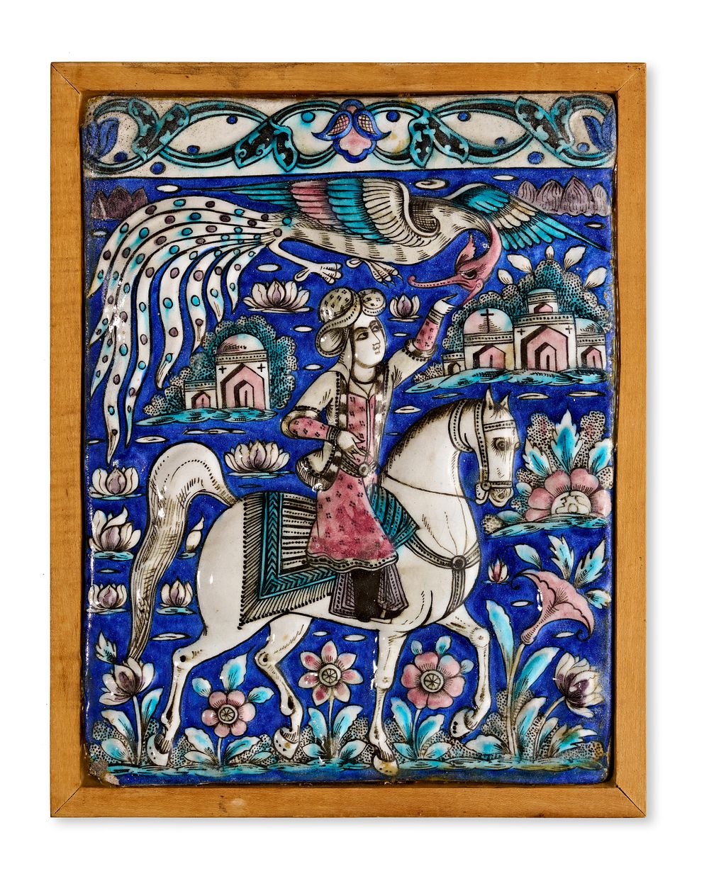 Lot 92: A QAJAR TEHRAN MOLDED POLYCHROME POTTERY TILE DEPICTING A PRINCE ON HORSEBACK, PERSIA, 19TH CENTURY