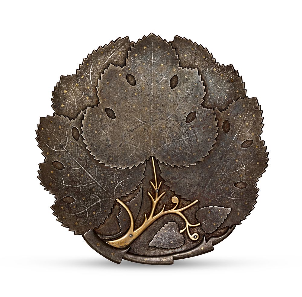 Lot 291: AN INDO-PERSIAN GOLD AND SILVER INLAID KOFTGARI STEEL LEAF PLATE, 19TH CENTURY