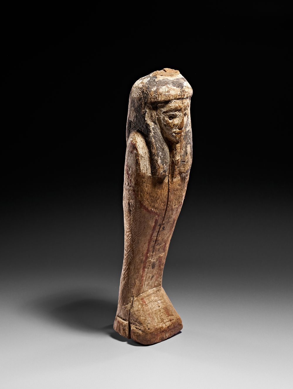Lot 250: A LARGE EGYPTIAN WOODEN FIGURE OF PTAH-SOKAR-OSIRIS
