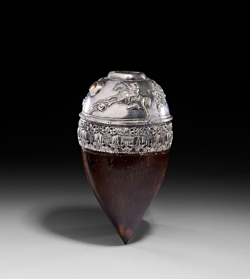Lot 294: A SILVER-MOUNTED COCONUT SHELL HUQQA BASE, QAJAR, 19TH CENTURY