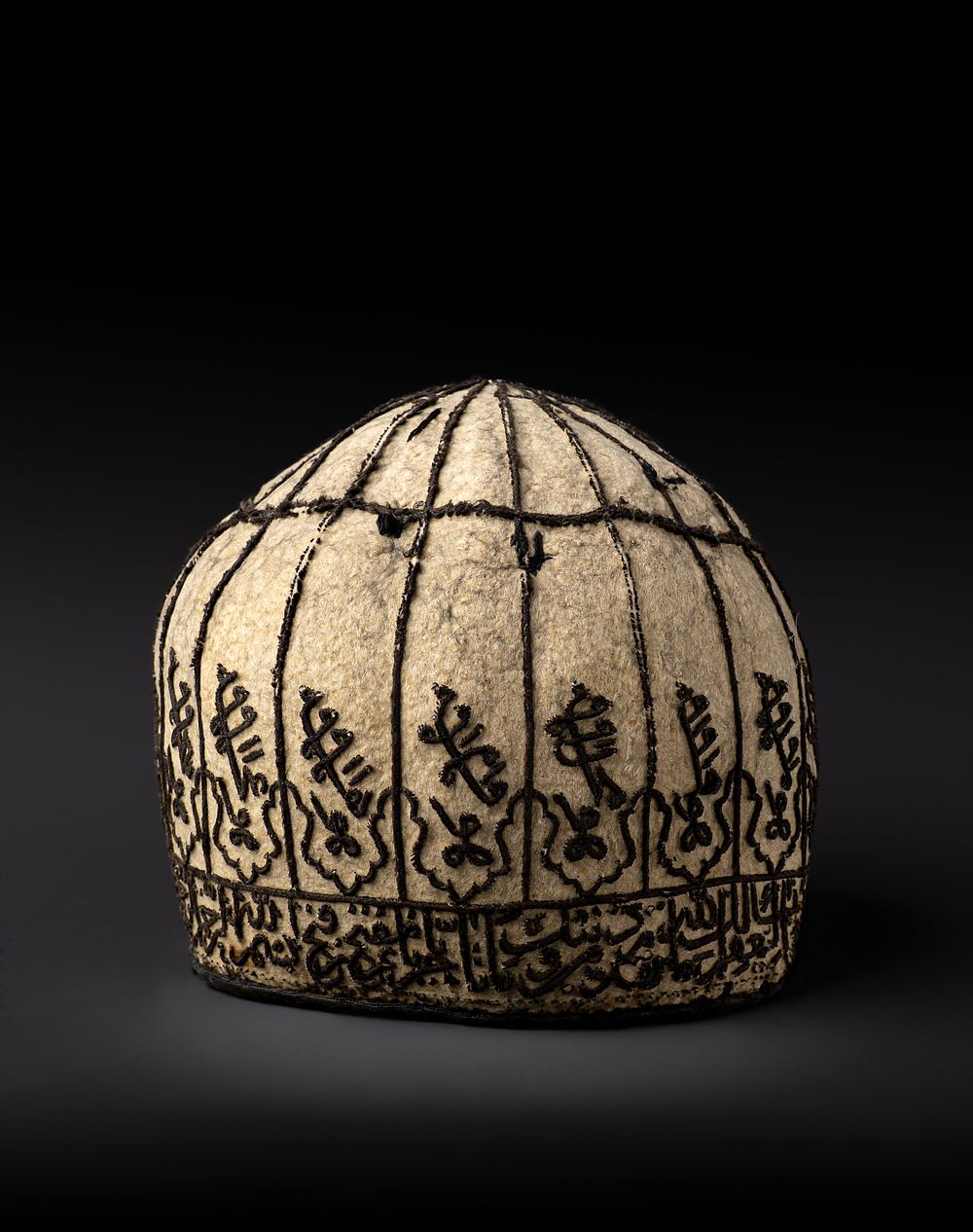 Lot 57: A RARE QAJAR FELT DERVISH HAT, 18TH - 19TH CENTURY