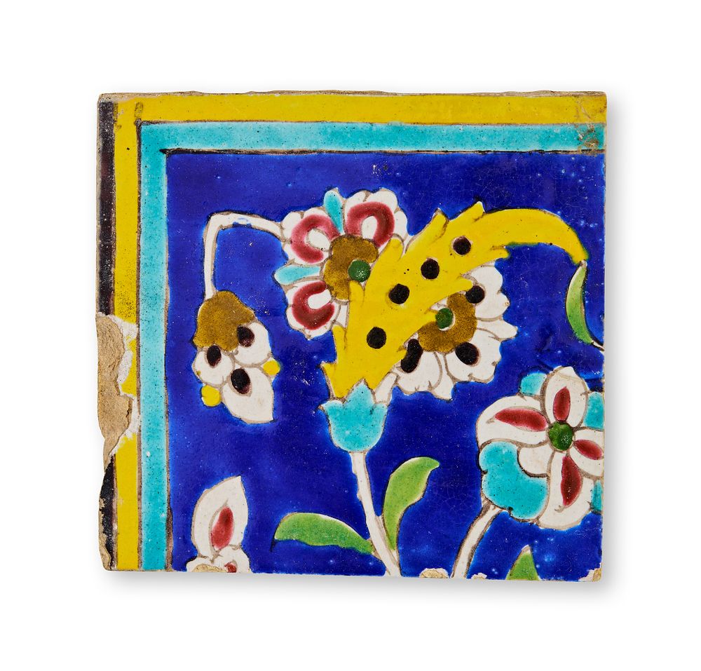 Lot 103: A QAJAR CUERDA SECA POTTERY TILE, IRAN, 19TH CENTURY