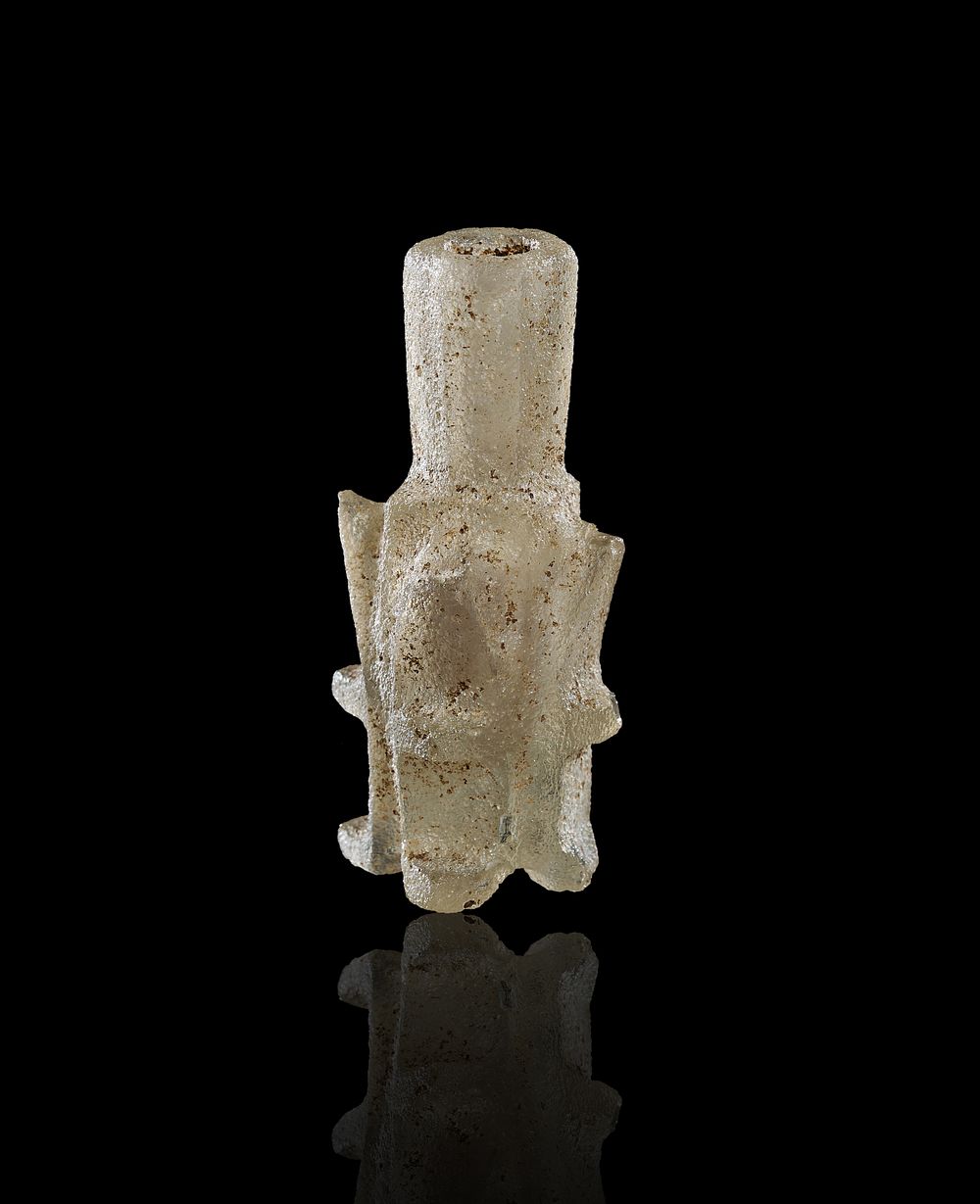 Lot 255: AN ISLAMIC FATIMID MOLD-BLOWN GLASS MOLAR FLASK, EGYPT, 10TH-11TH CENTURY