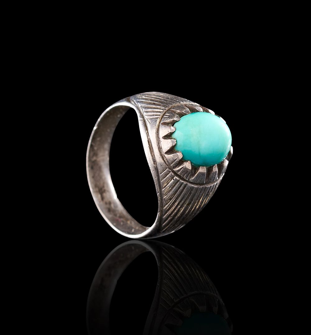 Lot 64: A TURQUOISE AND SILVER ISLAMIC RING