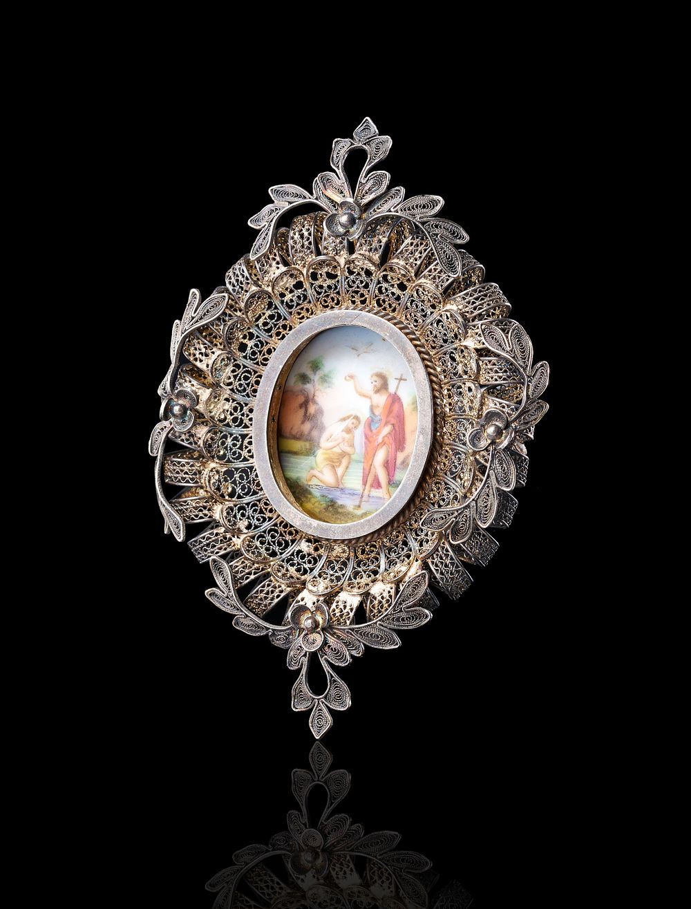 Lot 356: A VICTORIAN SILVER-TONED FILIGREE AND ENAMEL PENDANT DEPICTING THE BAPTISM OF CHRIST