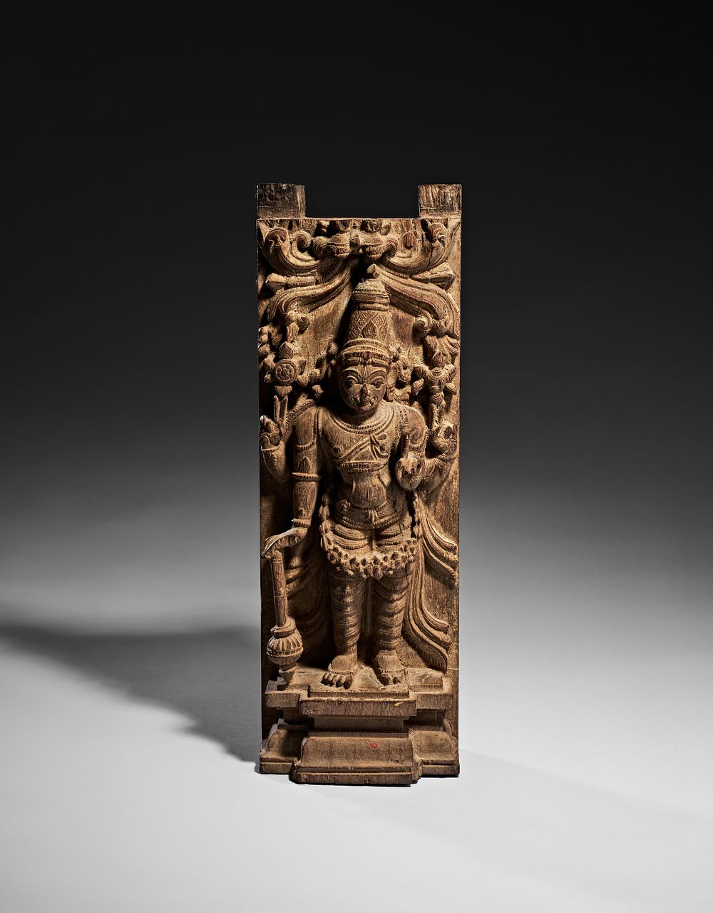 Lot 323: A SOUTH INDIAN CARVED WOOD ARCHITECTURAL PANEL DEPICTING VISHNU, 18TH CENTURY - 19TH CENTURY