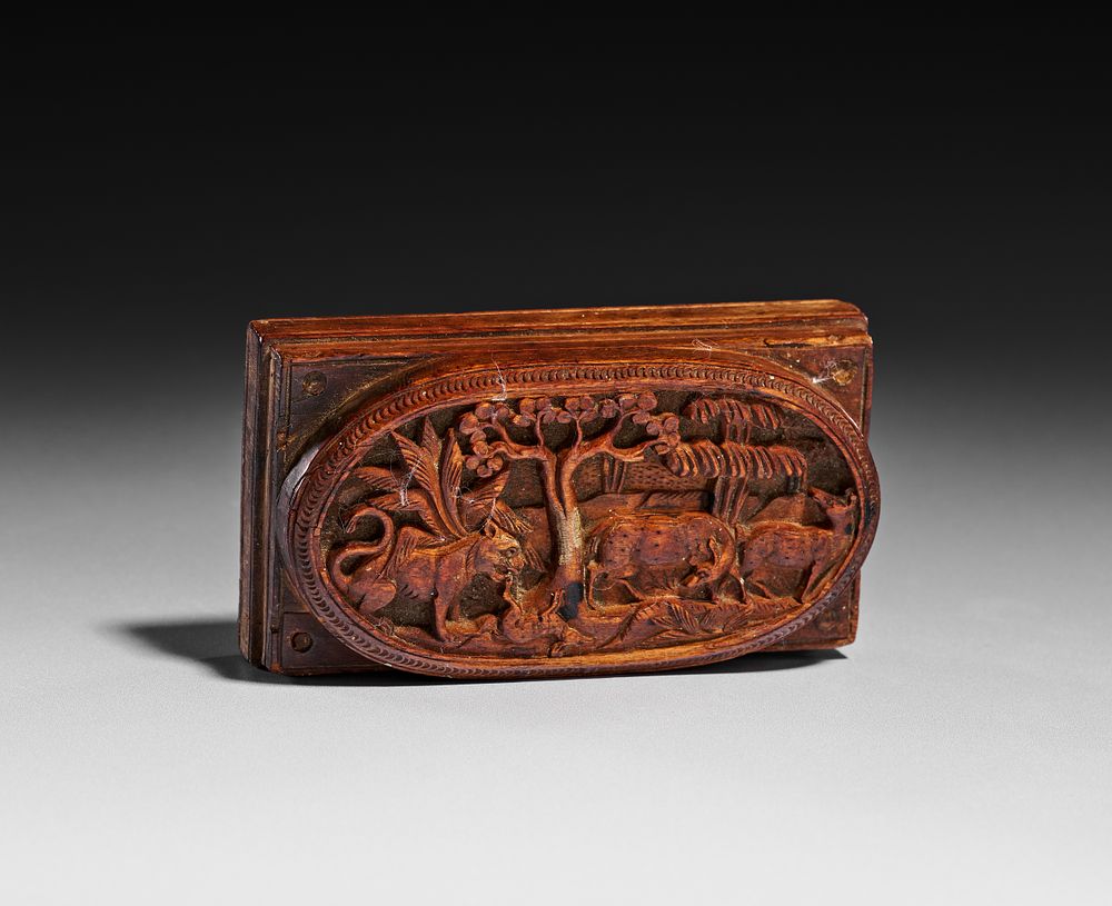 Lot 337: An Antique Carved Wood Relief Mold Featuring a Winged Lion and Deer
