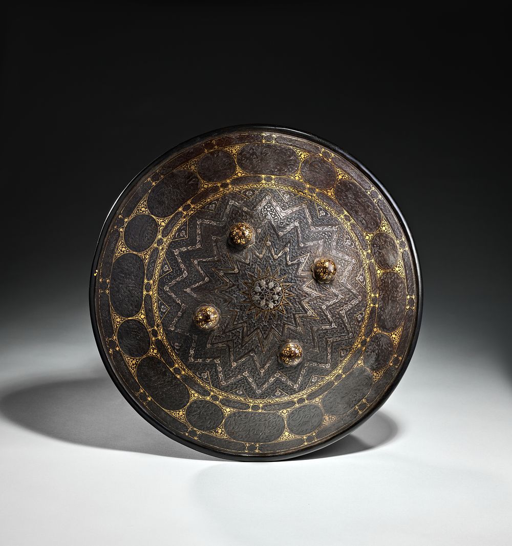 Lot 78: A QAJAR GOLD AND SILVER INLAID STEEL SHIELD (SIPAR), PERSIA, 19TH CENTURY