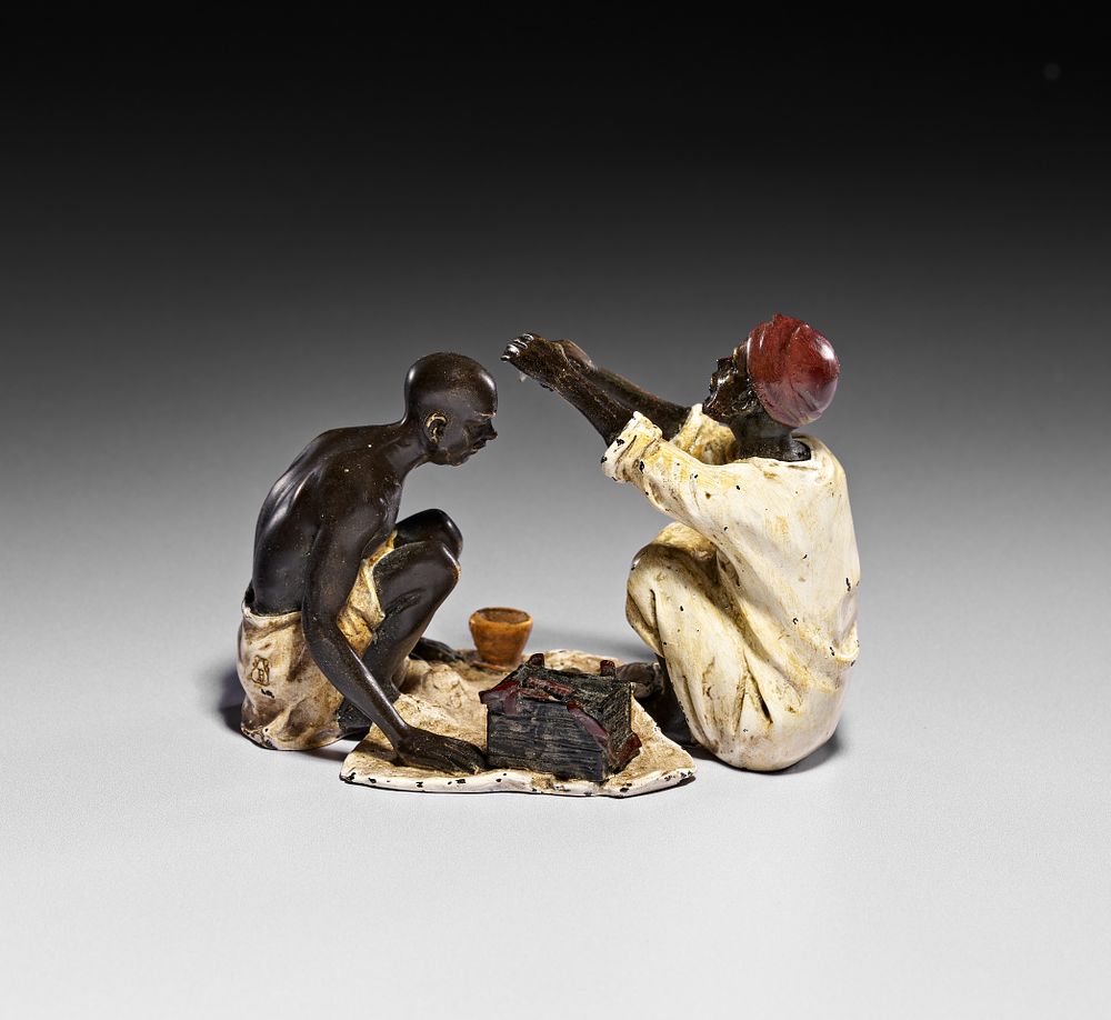 Lot 261: A COLD PAINTED BRONZE FIGURAL GROUP OF AN ARAB BARBER SIGNED FRANZ BERGMAN, CIRCA 1900