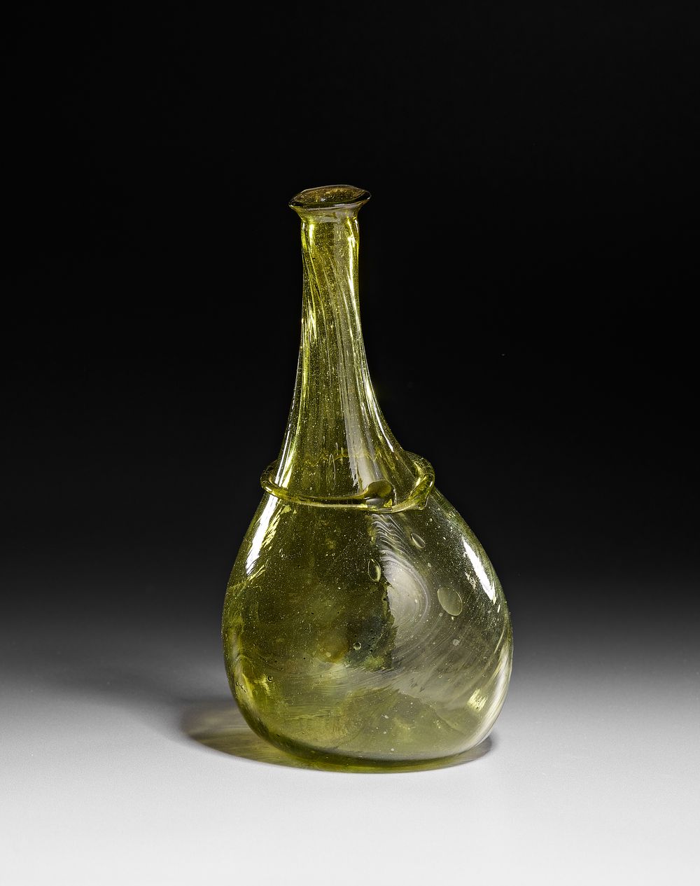 Lot 333: AN ISLAMIC SAFAVID GREEN GLASS VASE, PERSIA, 17TH CENTURY