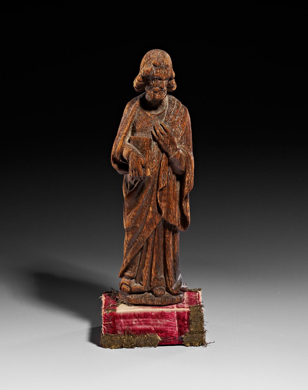 Lot 355: A LATE GOTHIC CARVED OAK FIGURE OF AN APOSTLE, PROBABLY 15TH - 16TH CENTURY
