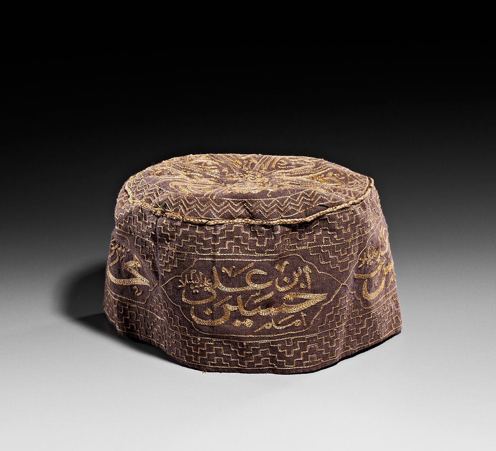 Lot 60: AN EMBROIDERED DERVISH HAT WITH CALLIGRAPHIC CARTOUCHES, 19TH CENTURY
