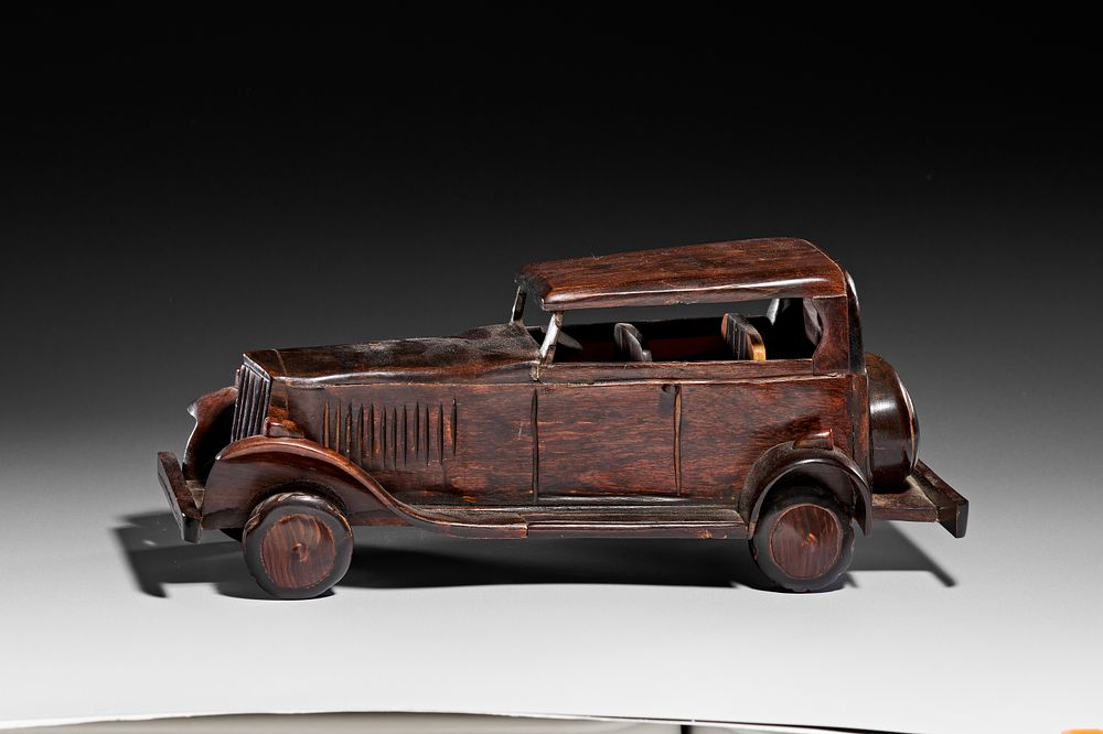 Lot 265: A VINTAGE INDIAN HANDCRAFTED COROMANDEL WOOD MODEL CAR, 20TH CENTURY