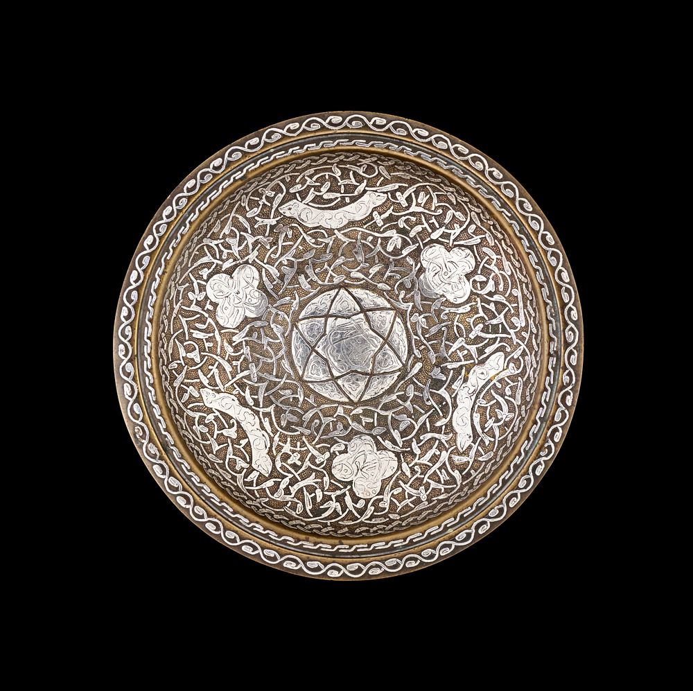 Lot 285: A MIDDLE EASTERN SILVER-INLAID BRASS DISH, EGYPT OR SYRIA, CIRCA 1900
