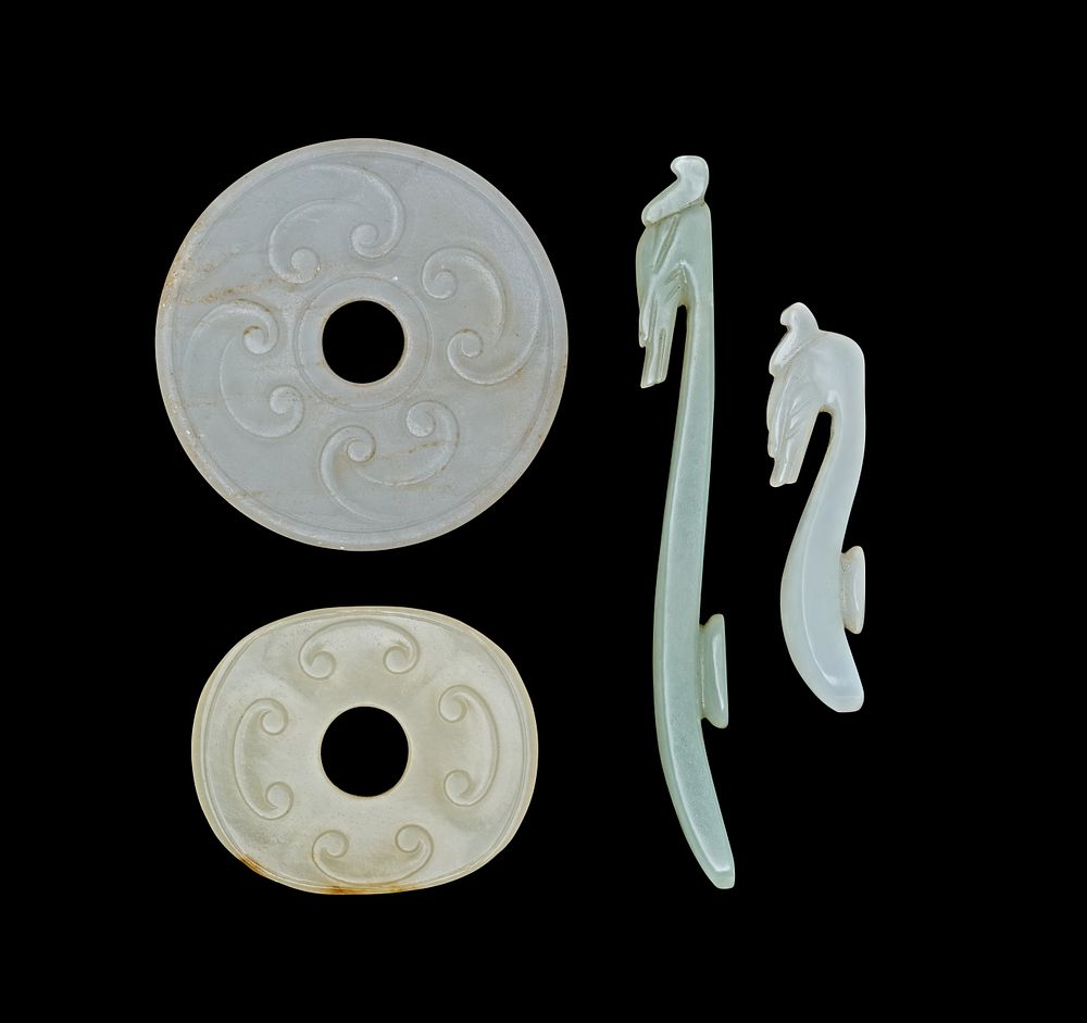 Lot 373: A COLLECTION OF CHINESE JADE BI DISCS AND BELT HOOKS, 18TH CENTURY