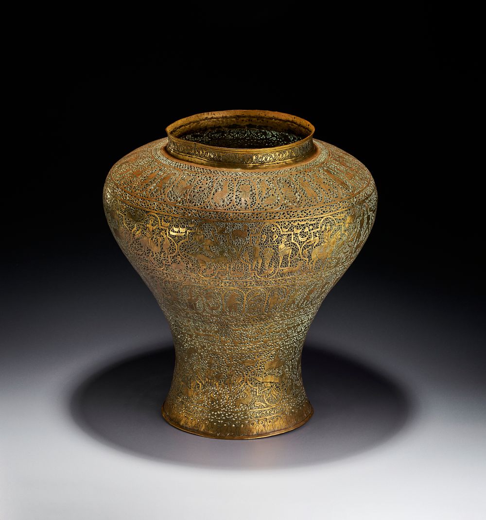 Lot 212: A PIERCED QAJAR BRASS VASE, PERSIAN, 19TH CENTURY