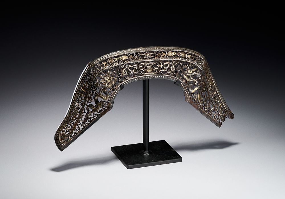 Lot 240: A CHINESE OR SINO-TIBETAN PIERCED IRON AND PARCEL-GILT SADDLE CANTLE PLAQUE, 16TH - 17TH CENTURY