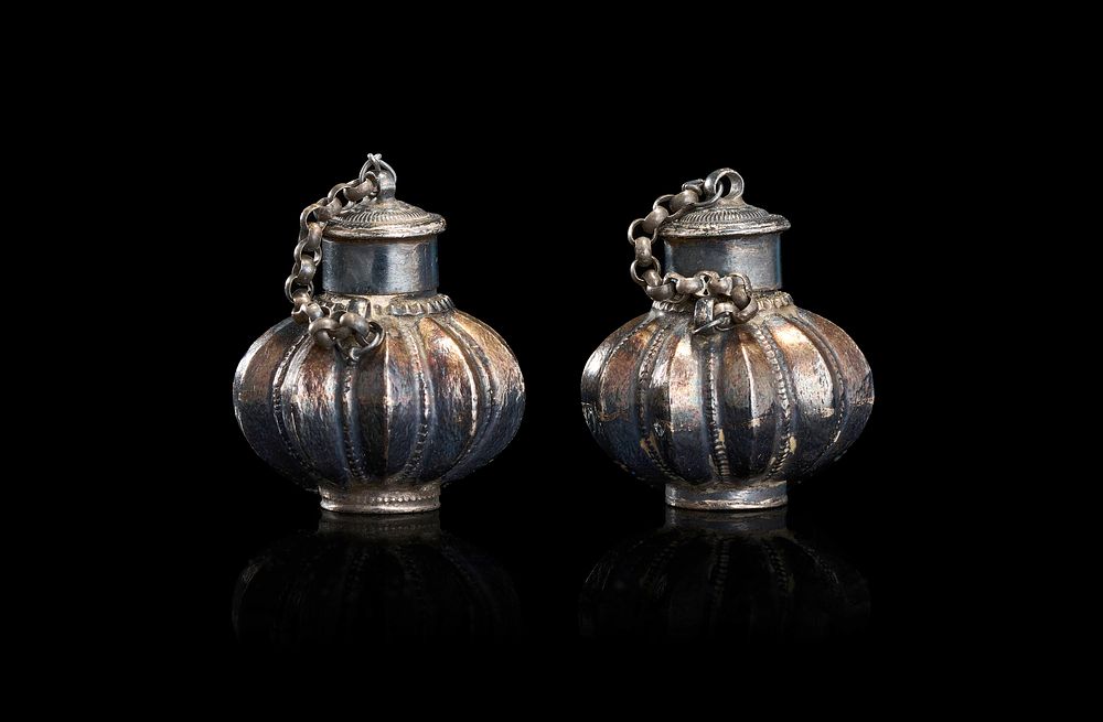 Lot 151: A PAIR OF SILVER-TONED MELON-FORM SCENT BOTTLES, INDIA, 19TH CENTURY