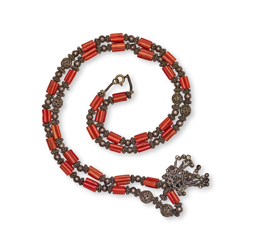 Lot 170: A CORAL AND SILVER-TONED FILIGREE BEAD NECKLACE WITH TASSEL PENDANT, YEMEN, 19TH CENTURY