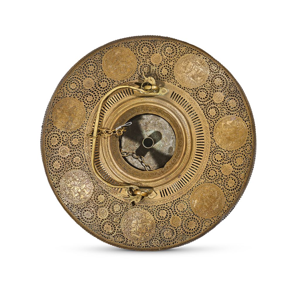 Lot 210: A QAJAR ROUND PIERCED AND ENGRAVED BRASS LAMP, PERSIA, 19TH CENTURY