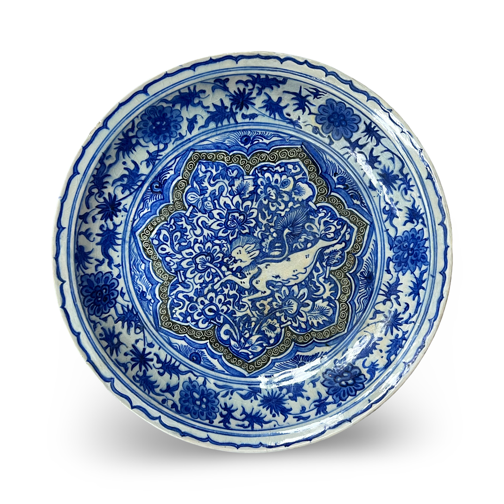 Lot 209: A BLUE AND WHITE SAFAVID POTTERY DISH DEPICTING A LION, PERSIA, 17TH CENTURY