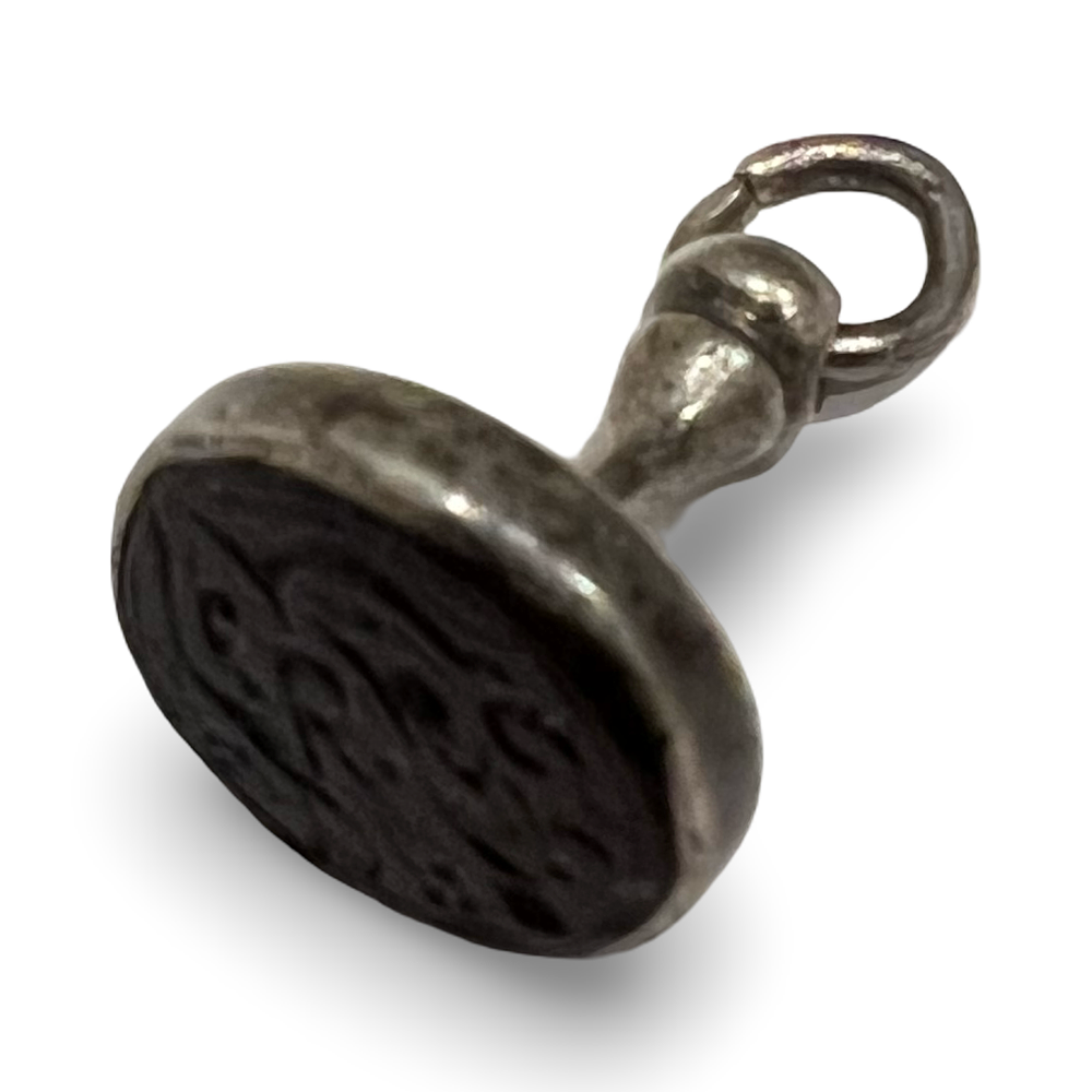 Lot 254: ANTIQUE SILVER FOB SEAL WITH ISLAMIC CALLIGRAPHIC INTAGLIO STONE MATRIX