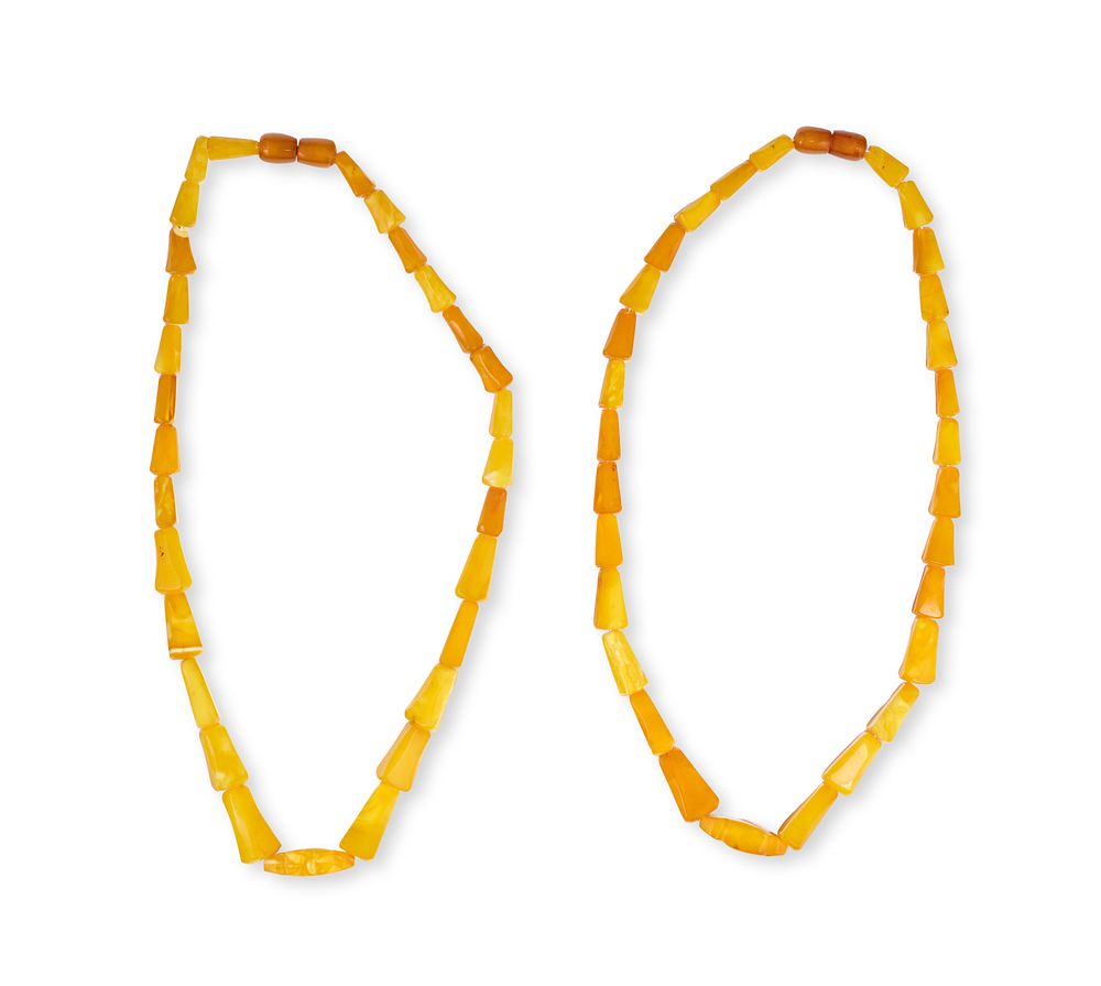 Lot 173: A PAIR OF TORVELA NATURAL AMBER NECKLACES