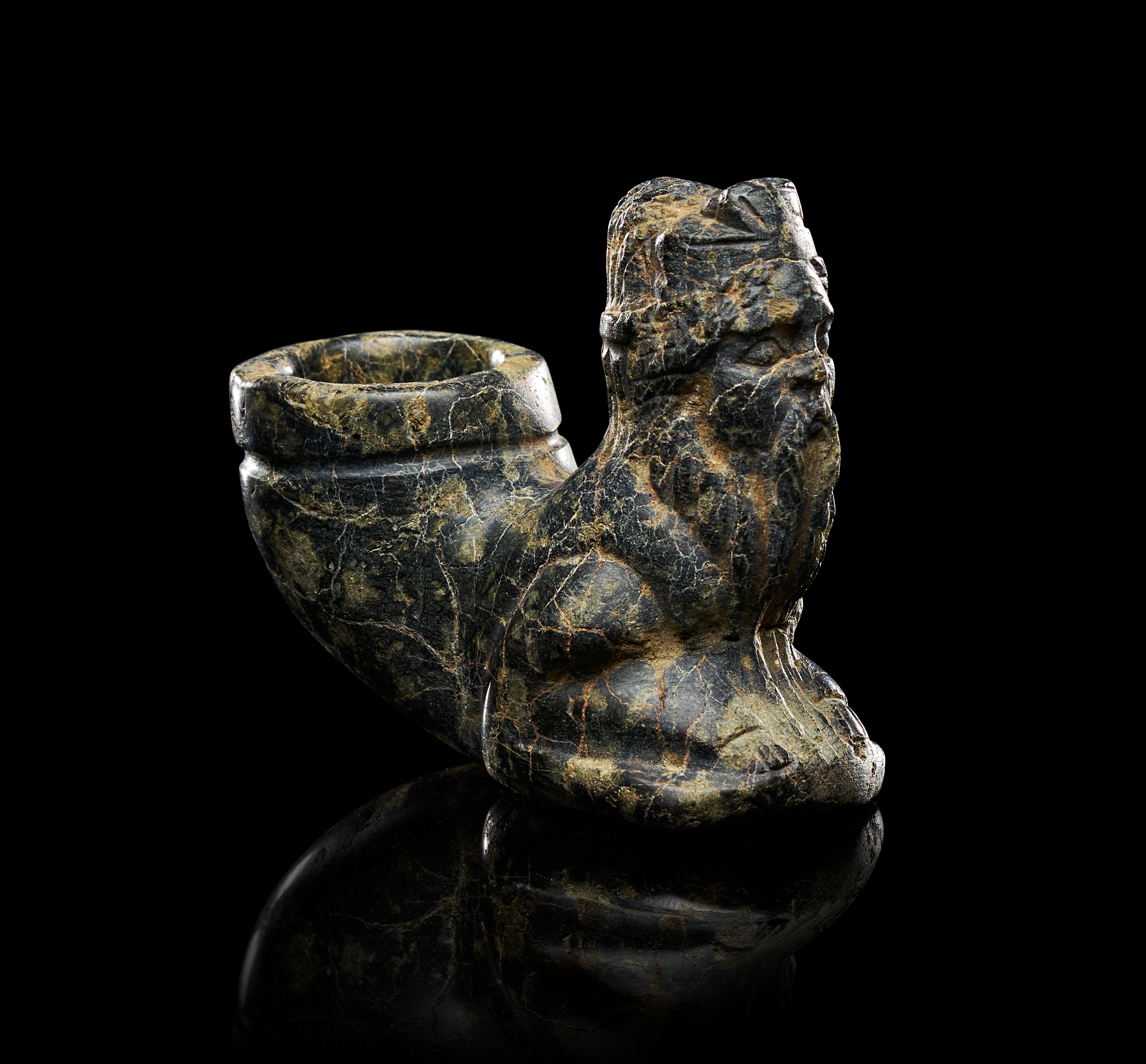 A STEATITE STONE FIGURE OF A SEATED BEARDED MAN IN THE FORM OF A VESSEL, GREEK PERIOD, 2ND CENTURY B.C