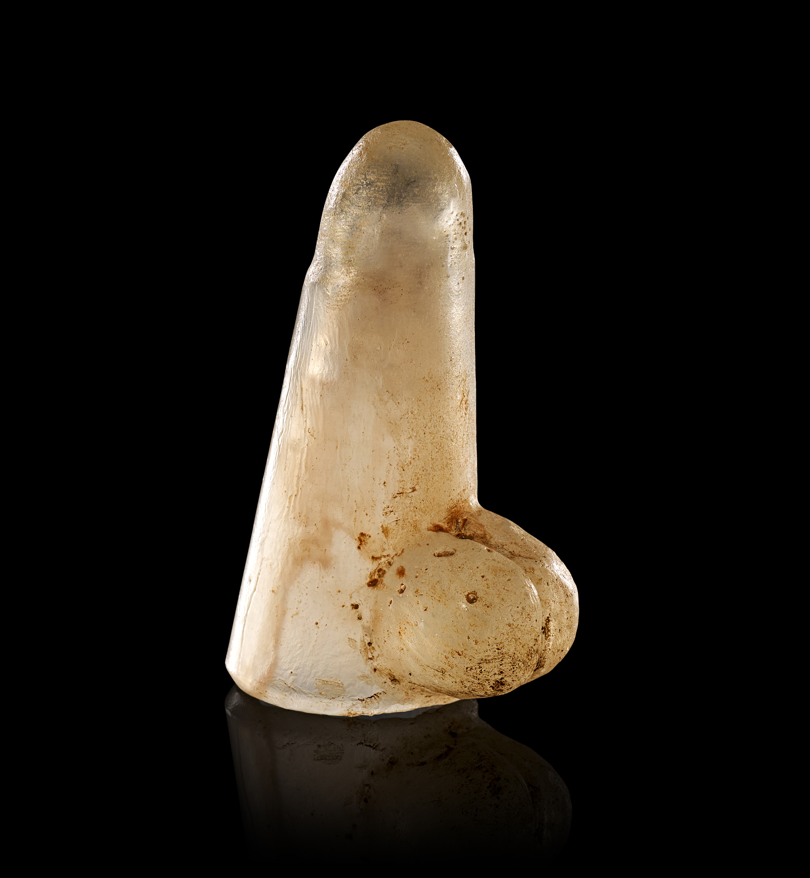 A TRANSLUCENT ROCK CRYSTAL PHALLUS, ROMANO-EGYPTIAN