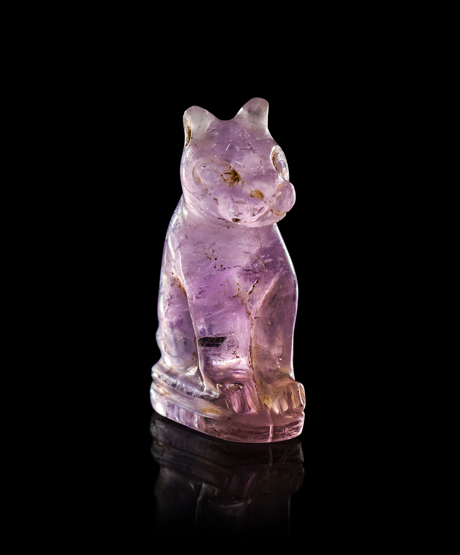 AN EGYPTIAN AMETHYST CAT AMULET LATE PERIOD TO PTOLEMAIC PERIOD, 664-30 B.C.
