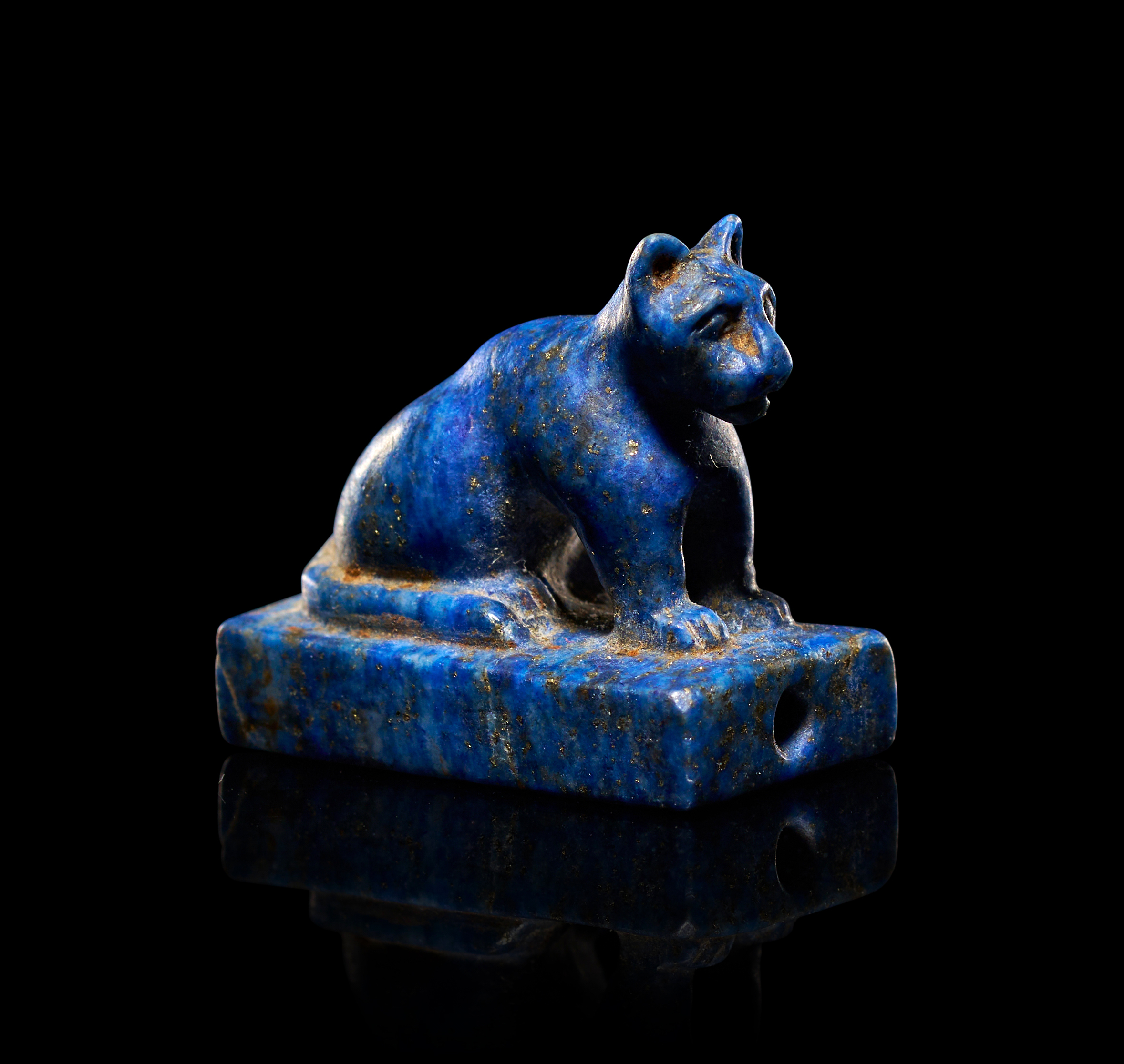 AN EGYPTIAN LAPIS LAZULI AMULET OF A CAT, LATE PERIOD-PTOLEMAIC PERIOD, CIRCA 664-30 B.C.
