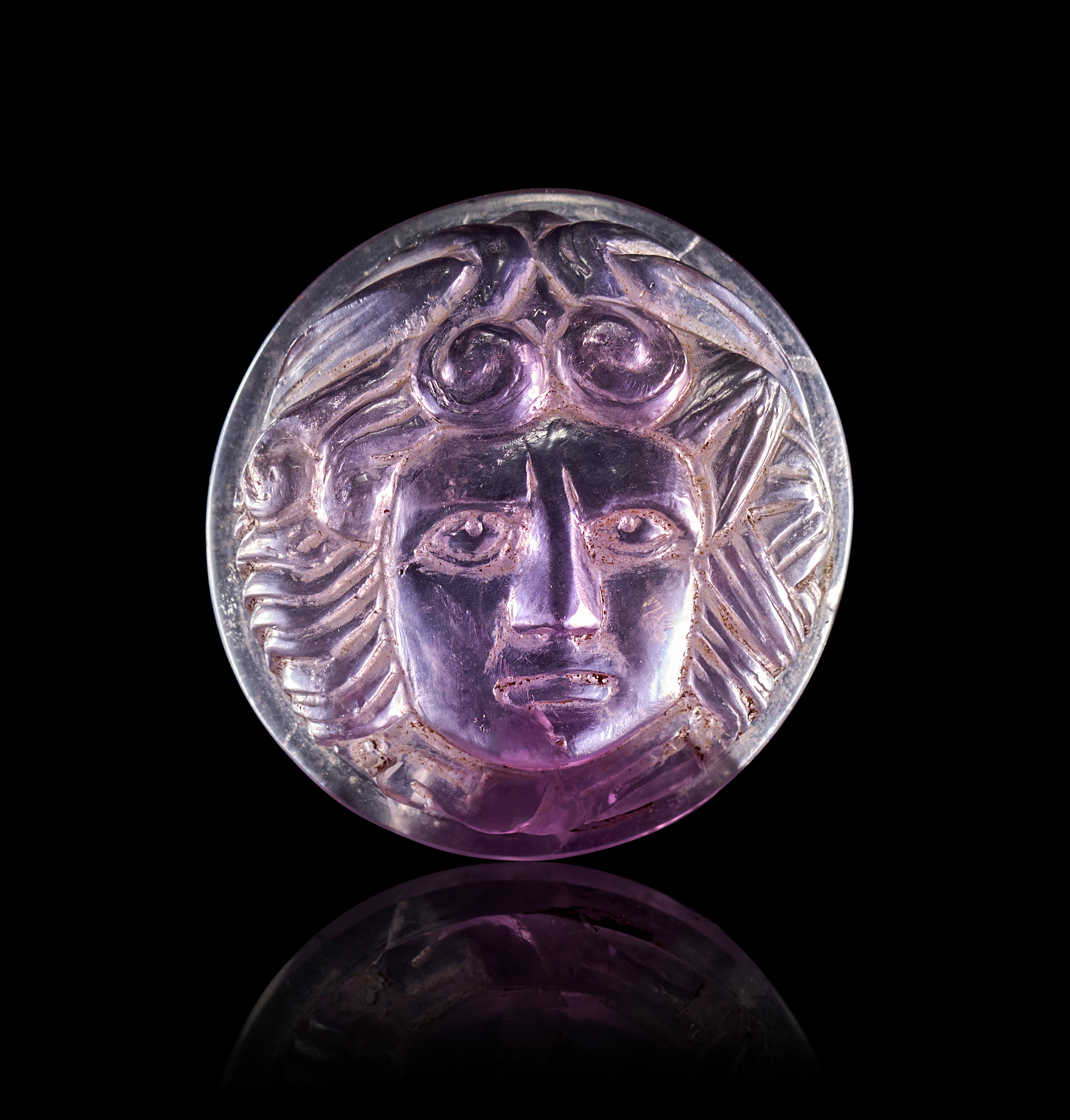 A ROMAN AMETHYST CAMEO OF MEDUSA, 1ST - 2ND CENTURY A.D. OR LATER