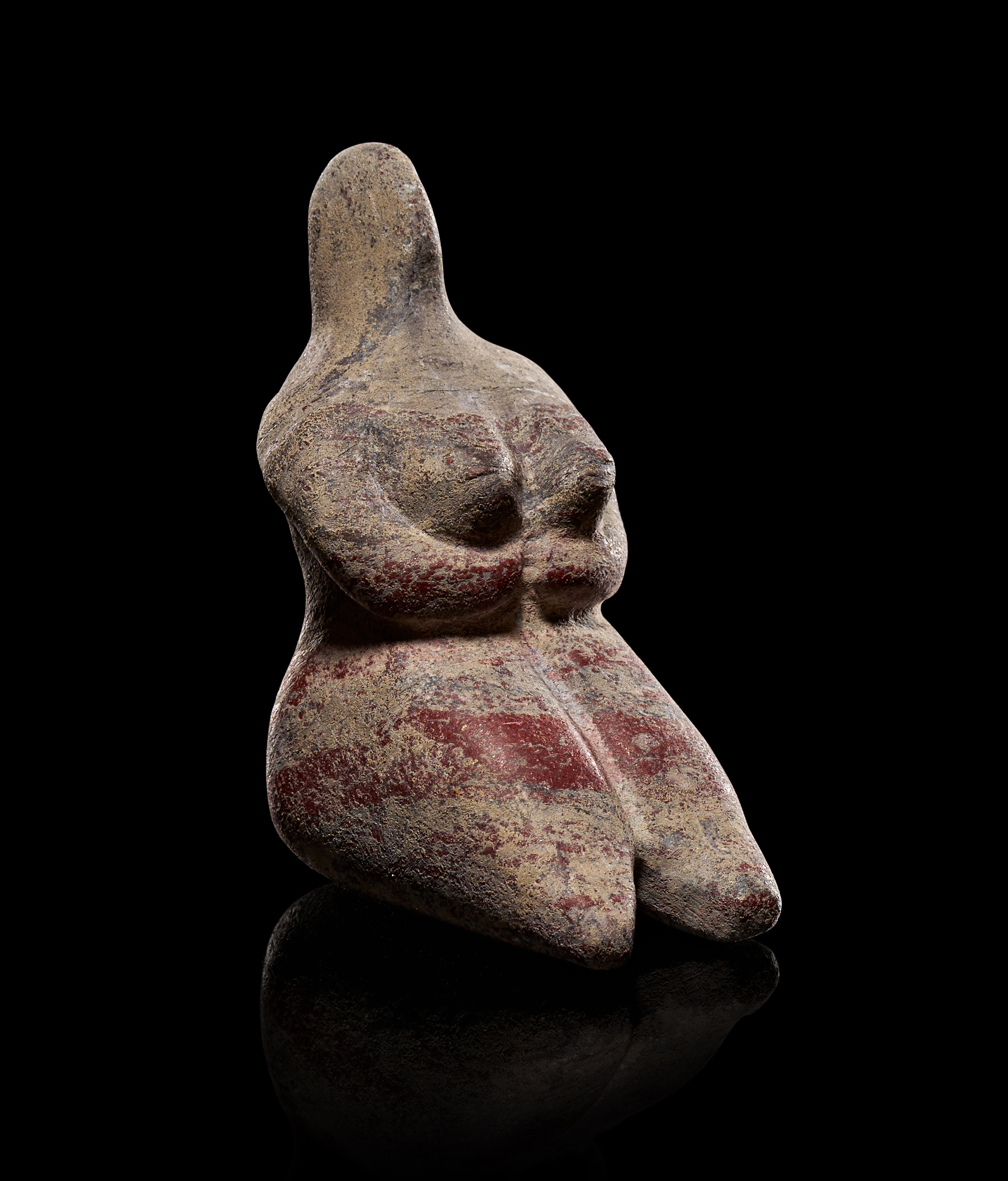 A MESOPOTAMIAN TERRACOTTA FEMALE IDOL, TEL HALAF TYPE, CIRCA 5000-4500 B.C.
