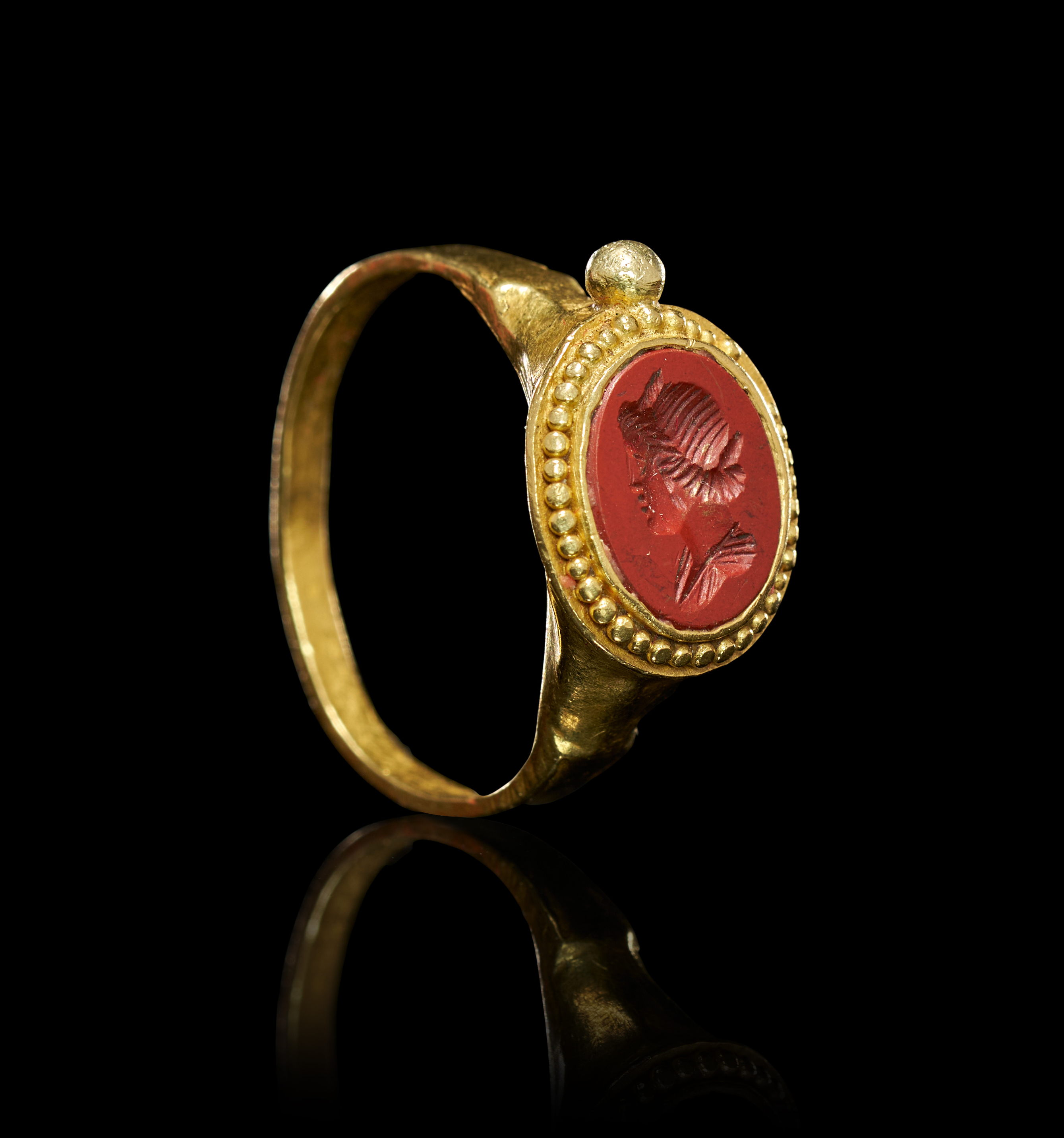 A LATE ROMAN JASPER YOUNG EMPEROR INTAGLIO RING SET ON GOLD, CIRCA 2ND CENTURY
