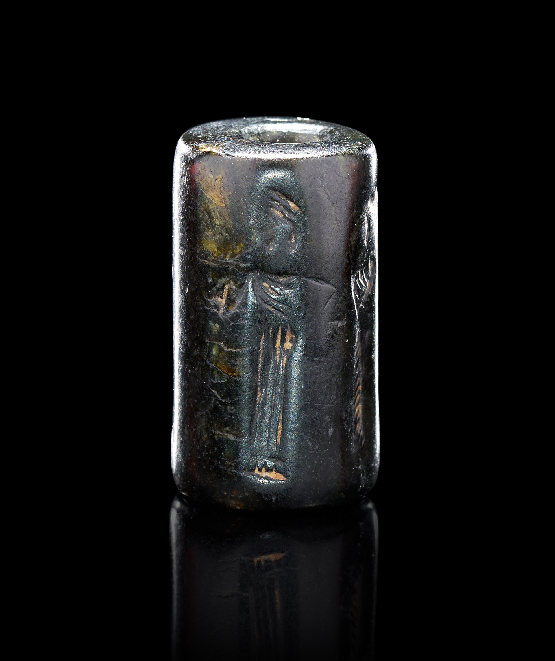 ANCIENT NEAR EASTERN HEMATITE CYLINDER SEAL WITH A PRESENTATION SCENE