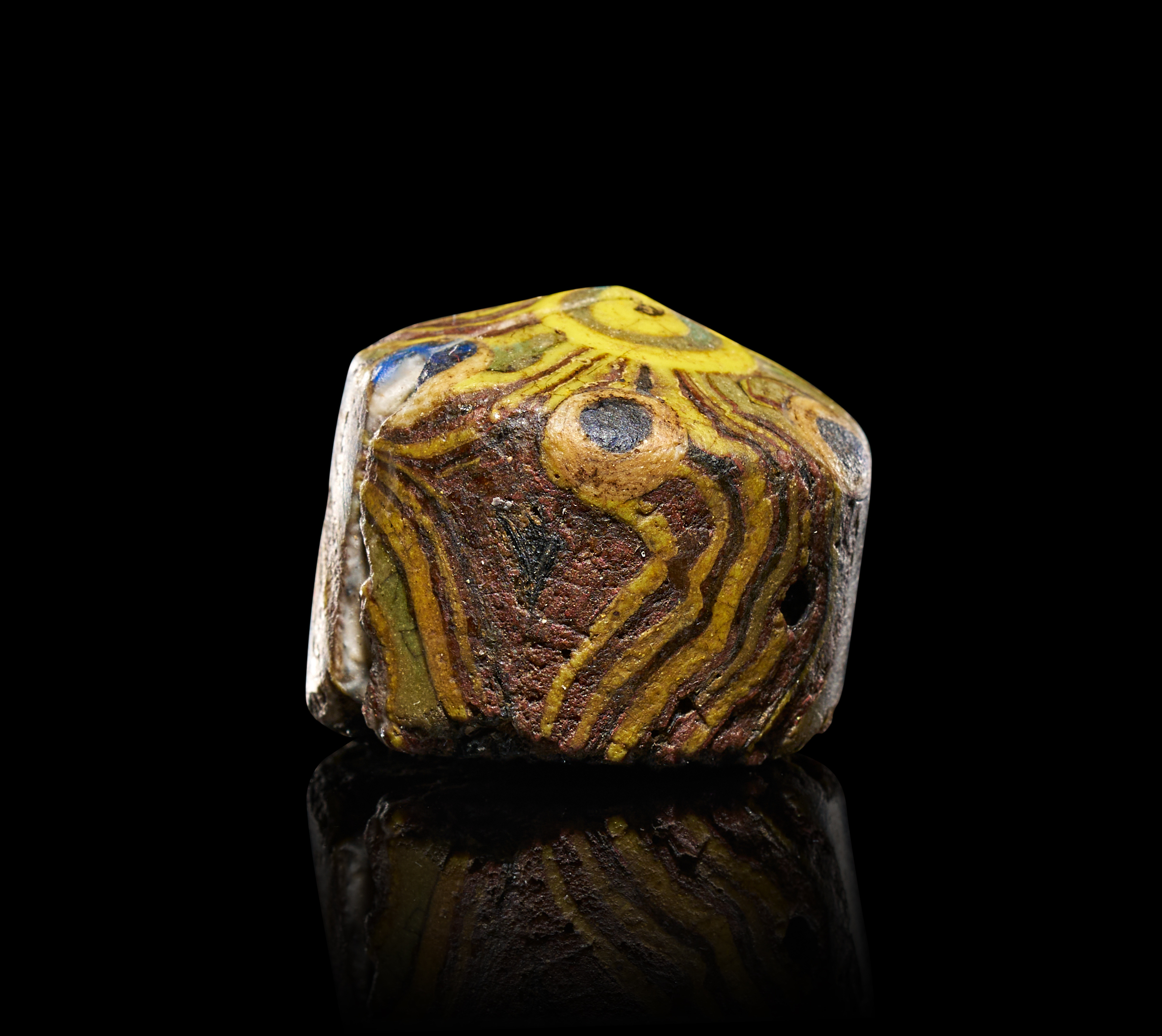 AN ANCIENT ROMAN MOSAIC GLASS GAMING PIECE