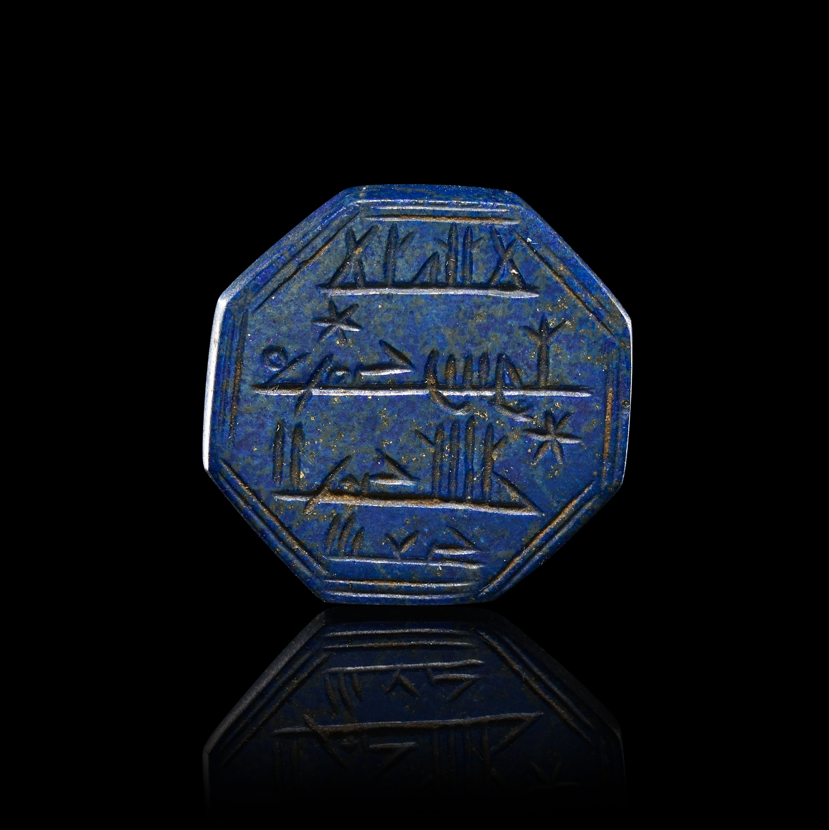 AN ISLAMIC OCTAGONAL LAPIS LAZULI CALLIGRAPHIC AMULET OR SEAL, 19TH CENTURY