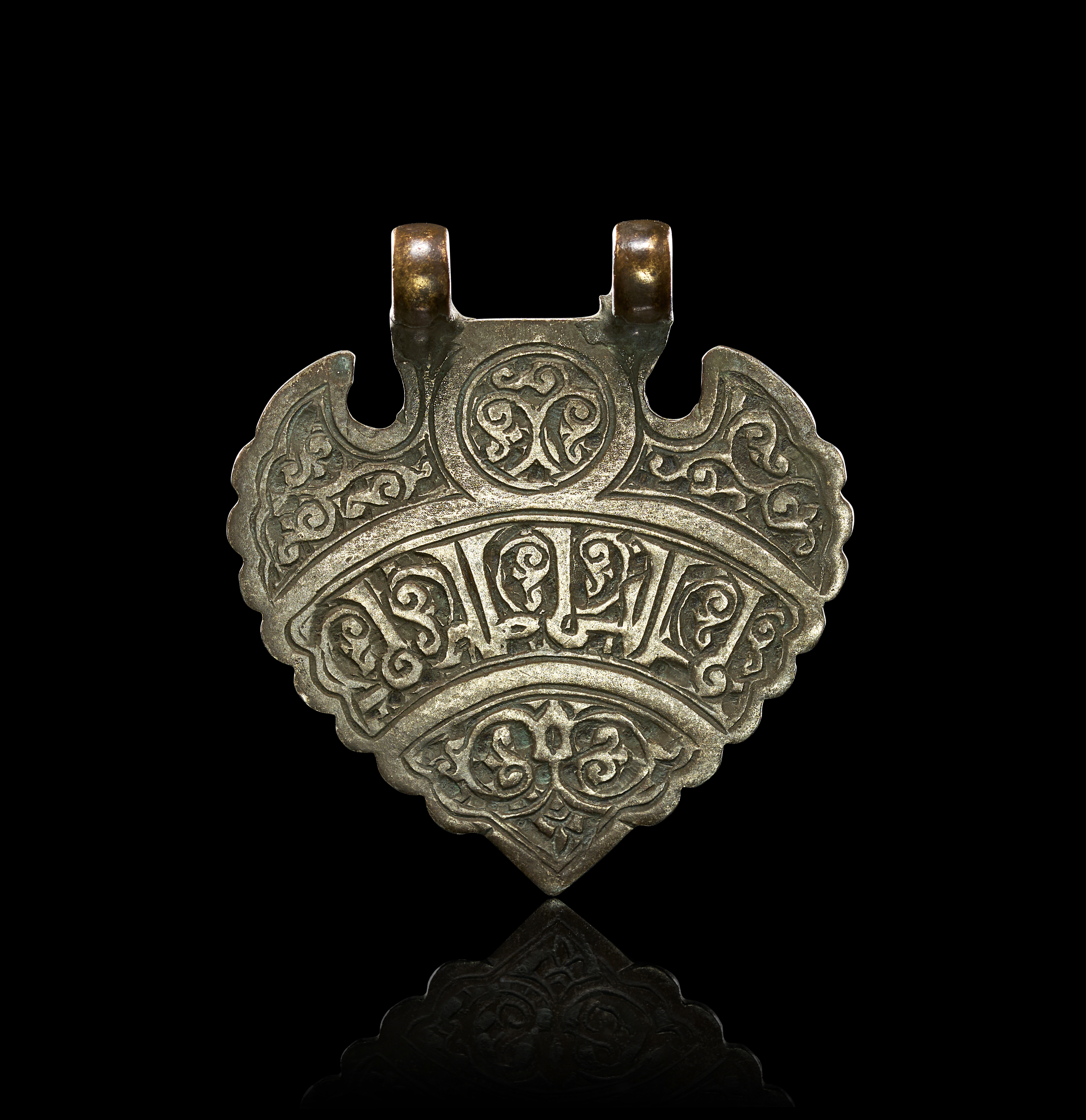A SELJUK SILVER PENDANT AMULET WITH KUFIC INSCRIPTION, PERSIA, 12TH CENTURY