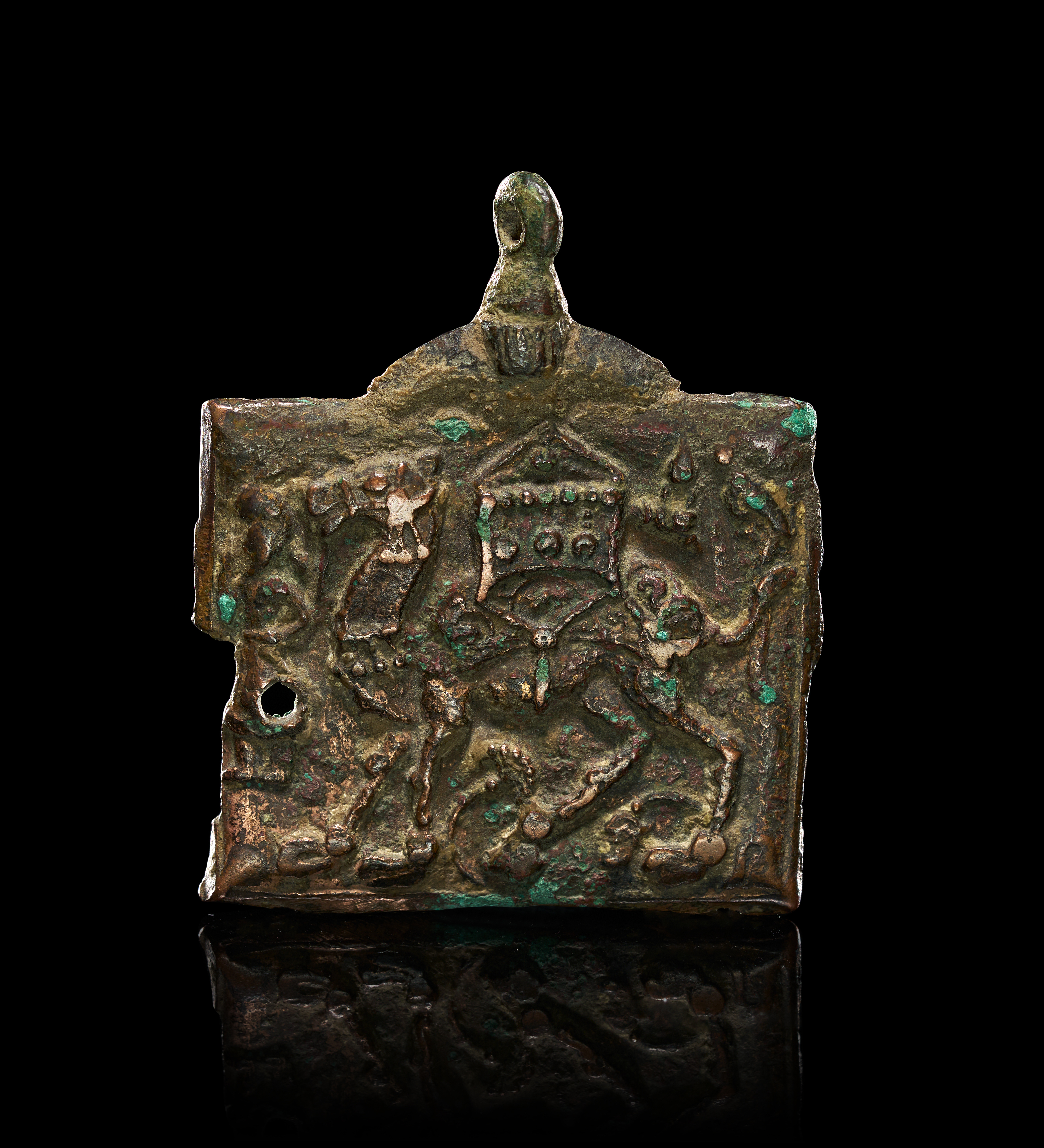 A BRONZE PENDANT WITH CAMEL DEPICTION, PERSIA OR INDIA, 12TH - 13TH CENTURY