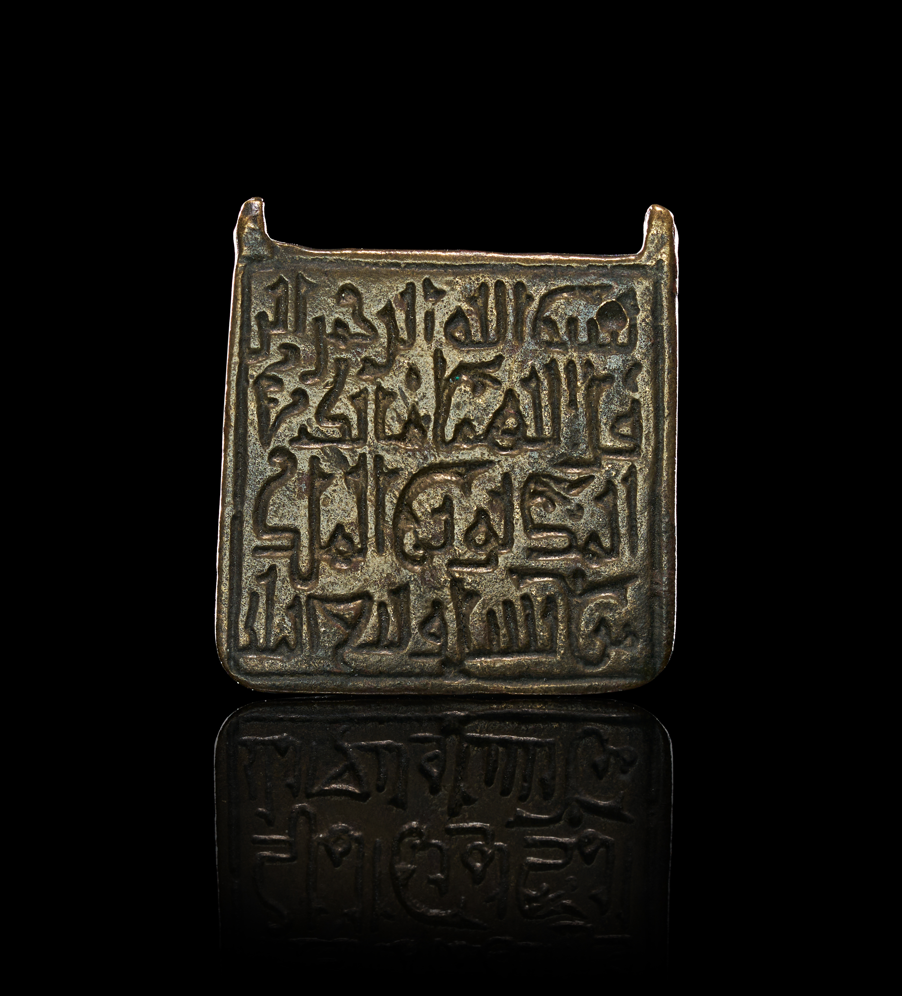 A RARE FATIMID KUFIC TALISMANIC HIRZ PLAQUE/PENDANT, EGYPT OR SYRIA, 10TH - 12TH CENTURY