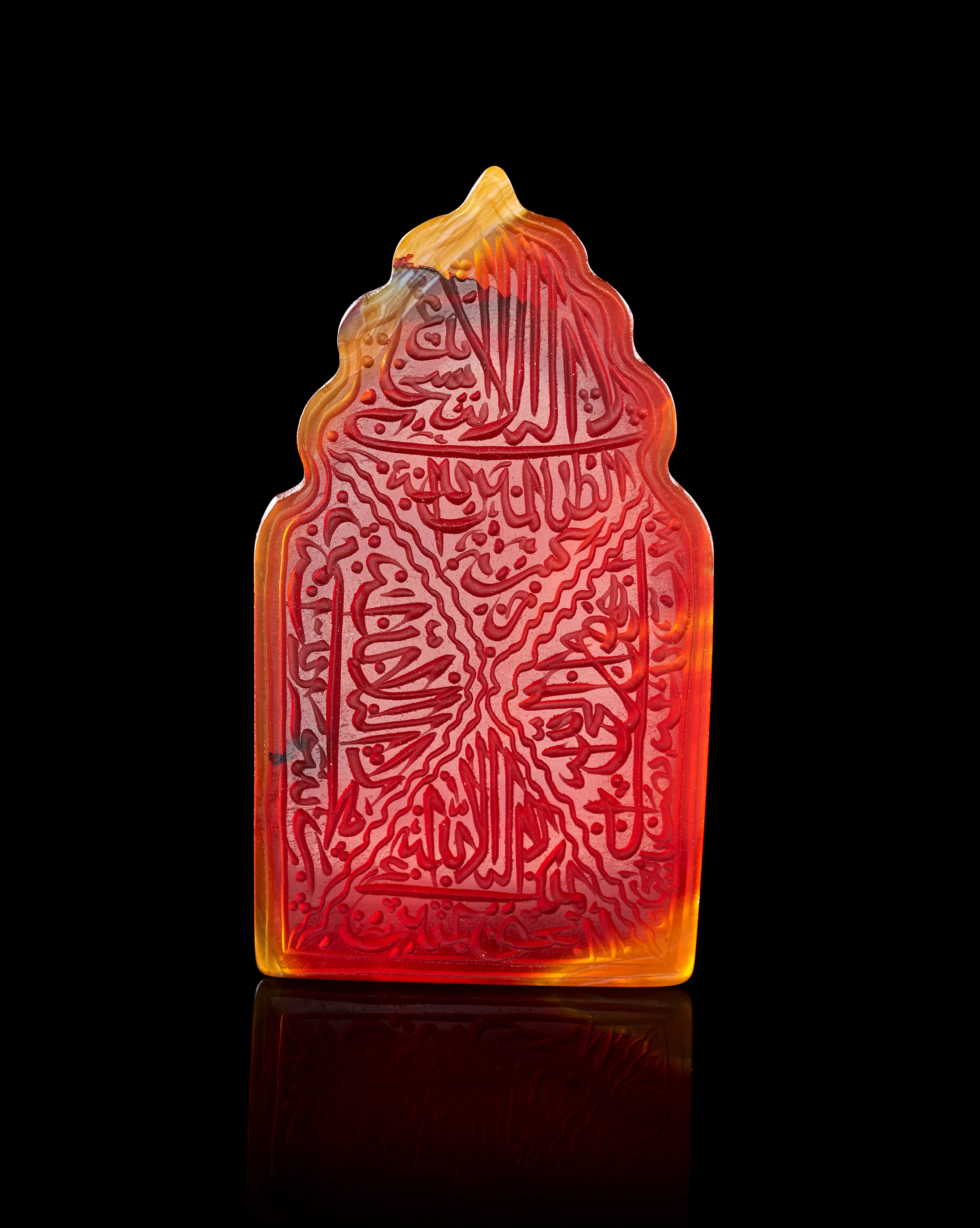 A LARGE CARVED CARNELIAN CALLIGRAPHIC TALISMANIC PLAQUE IN THE FORM OF A MIHRAB, PERSIA, 19TH CENTURY