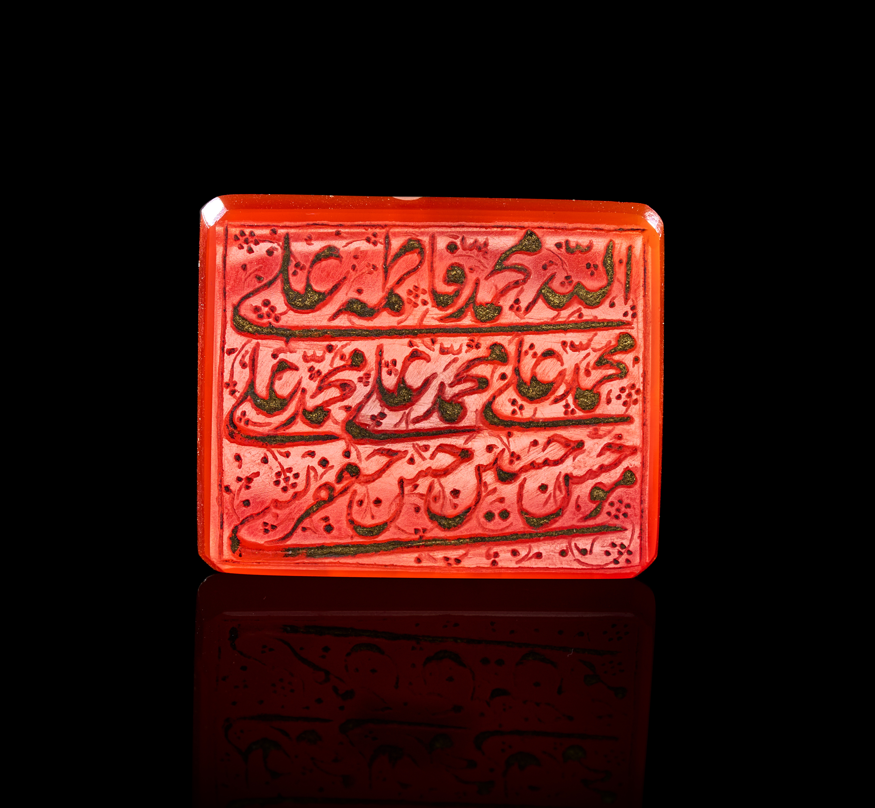 A QAJAR CARNELIAN AMULET PLAQUE ENGRAVED WITH THE FOURTEEN INFALLIBLES, PERSIA, 19TH CENTURY