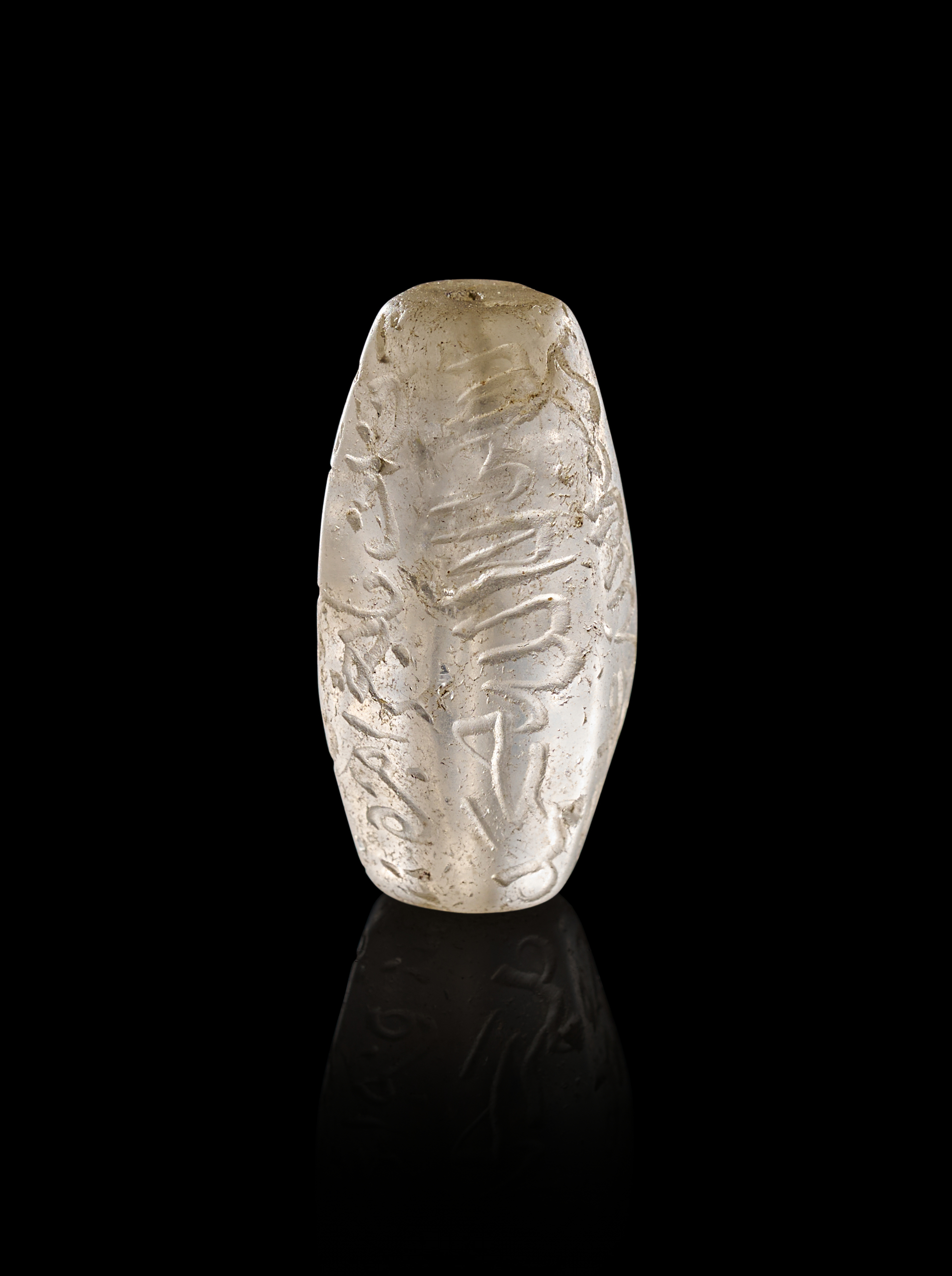 AN INSCRIBED ISLAMIC ROCK CRYSTAL TALISMANIC BEAD, 19TH CENTURY OR EARLIER