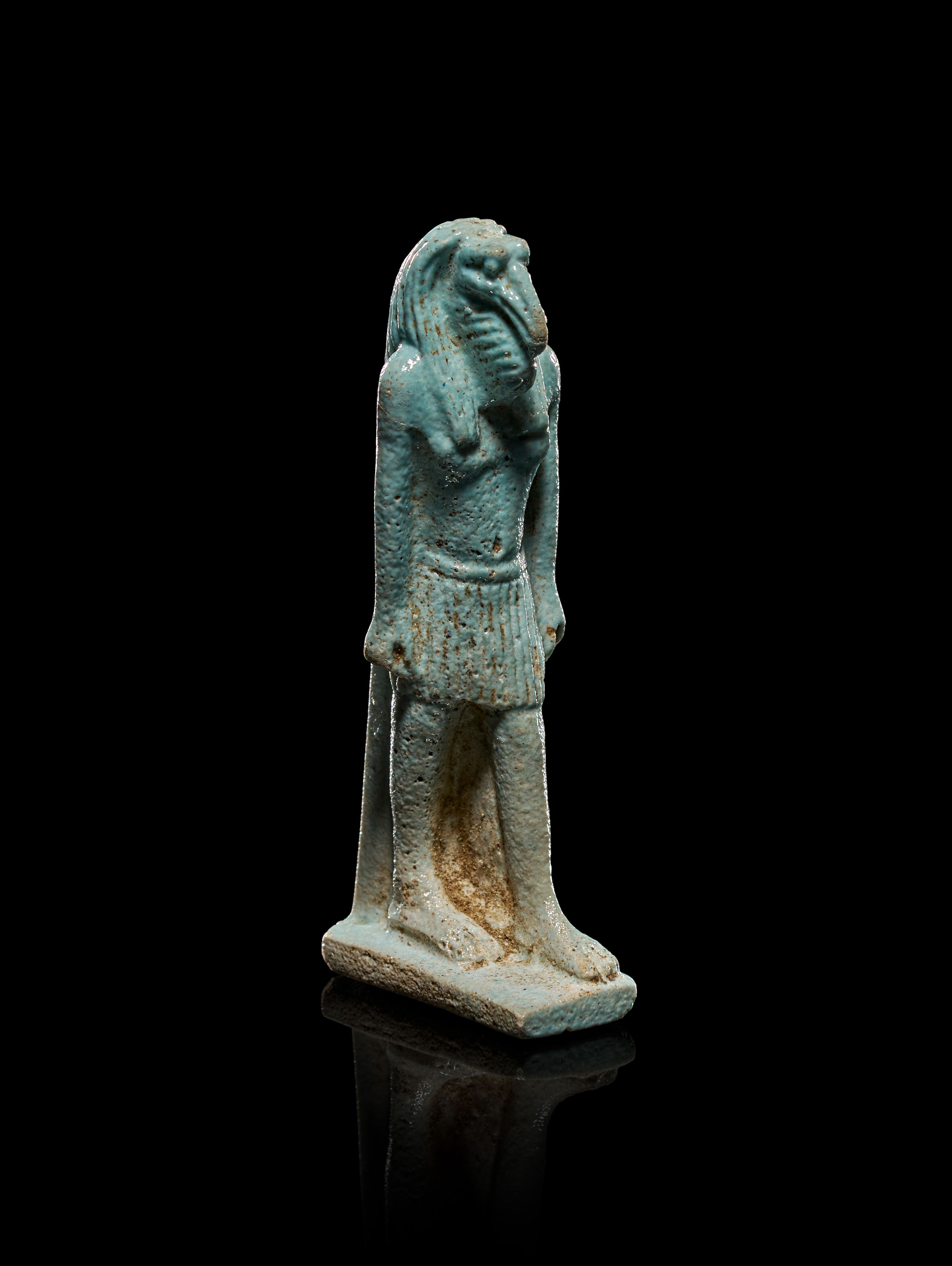 AN ANCIENT EGYPTIAN FAIENCE AMULET OF THE GOD THOTH,  LATE PERIOD, CIRCA 6TH - 4TH CENTURY B.C.