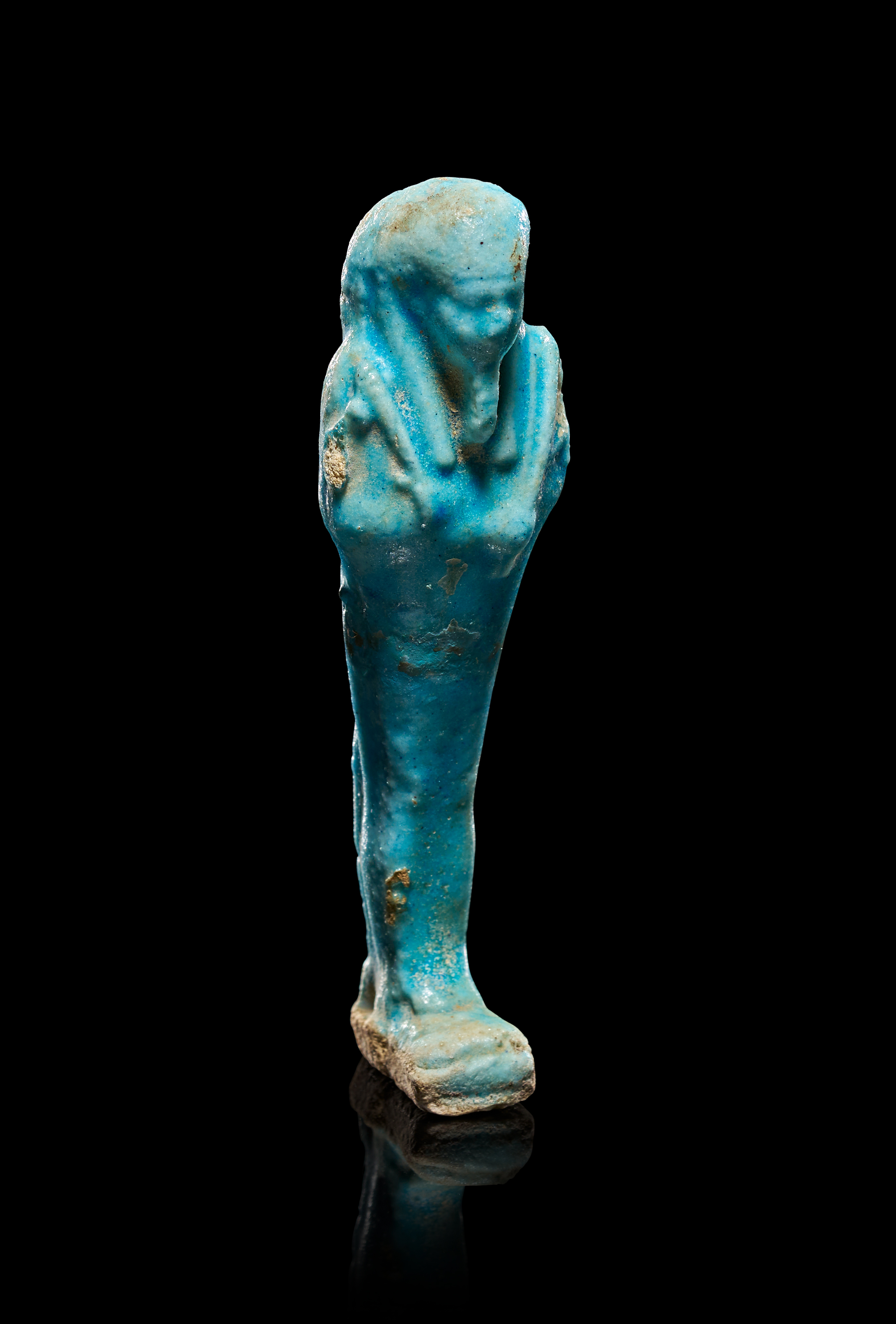 AN EGYPTIAN TURQUOISE FAIENCE SHABTI, LATE PERIOD, CIRCA 664-332 B.C.