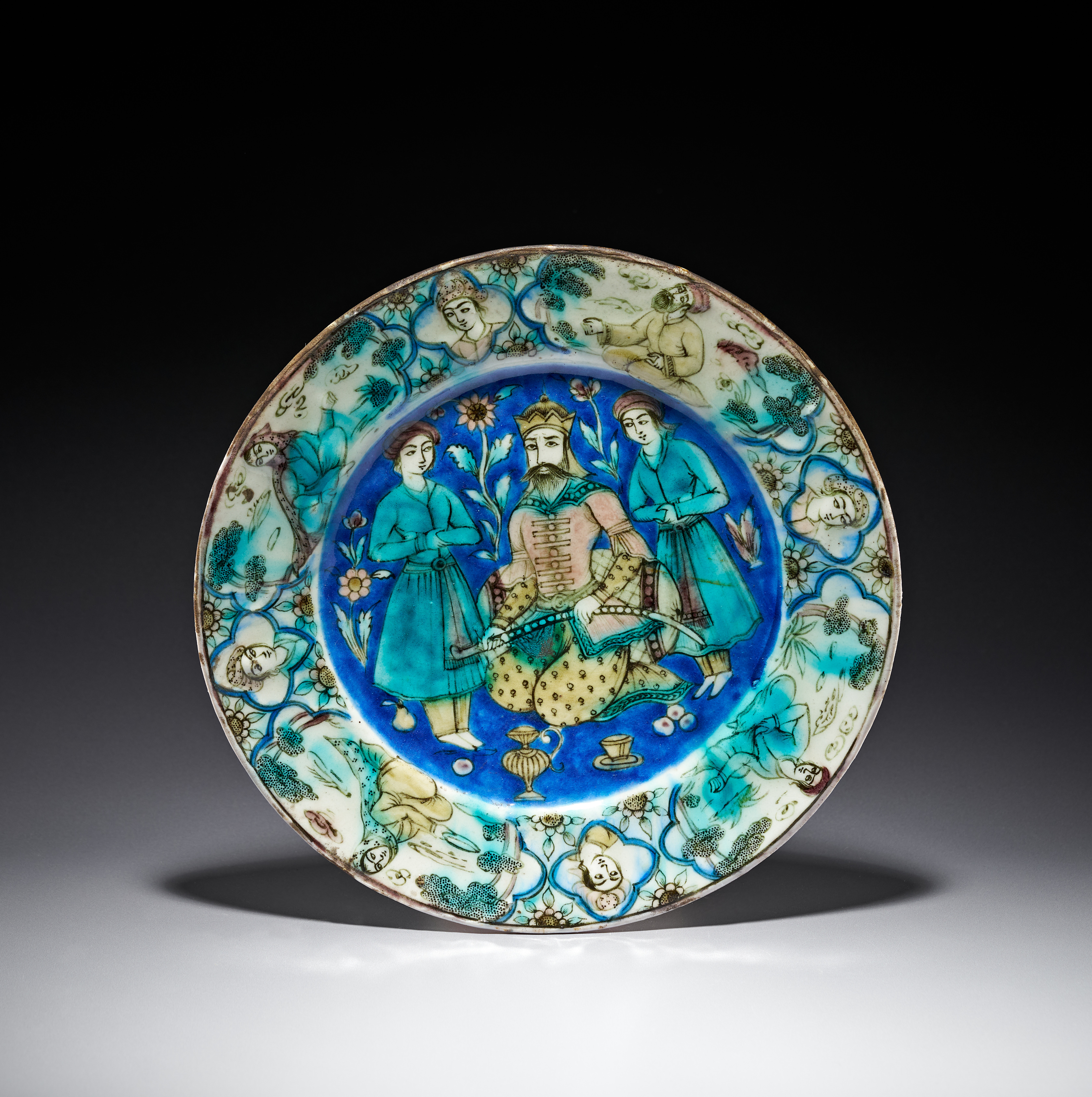 A PERSIAN QAJAR POLYCHROME UNDERGLAZE CERAMIC DISH, 19TH CENTURY