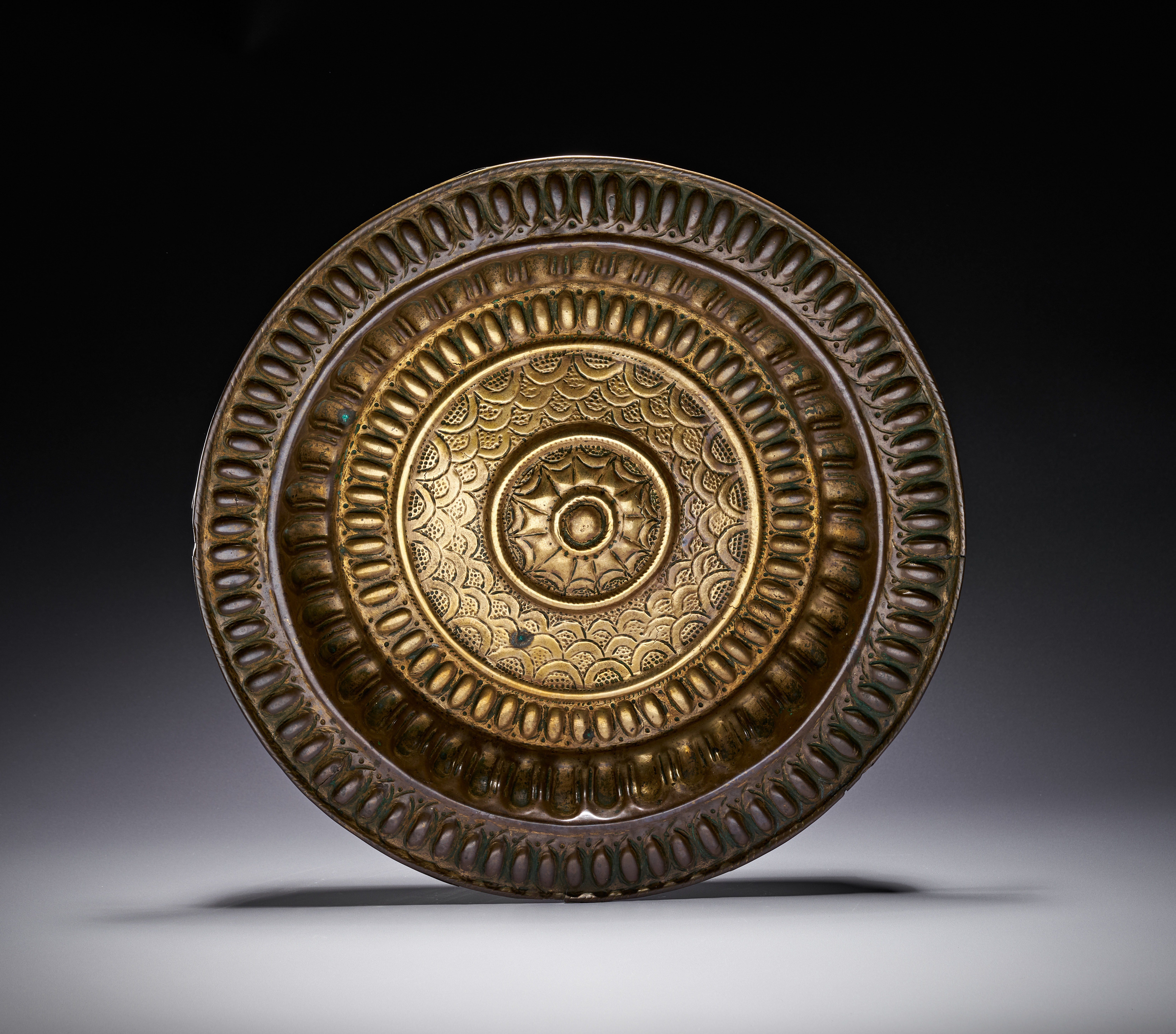 A LARGE SUNBURST DESIGN OTTOMAN GILDED COPPER OR BRASS PROBABLY TOMBAK CHARGER, TURKEY, 18TH - 19TH CENTURY
